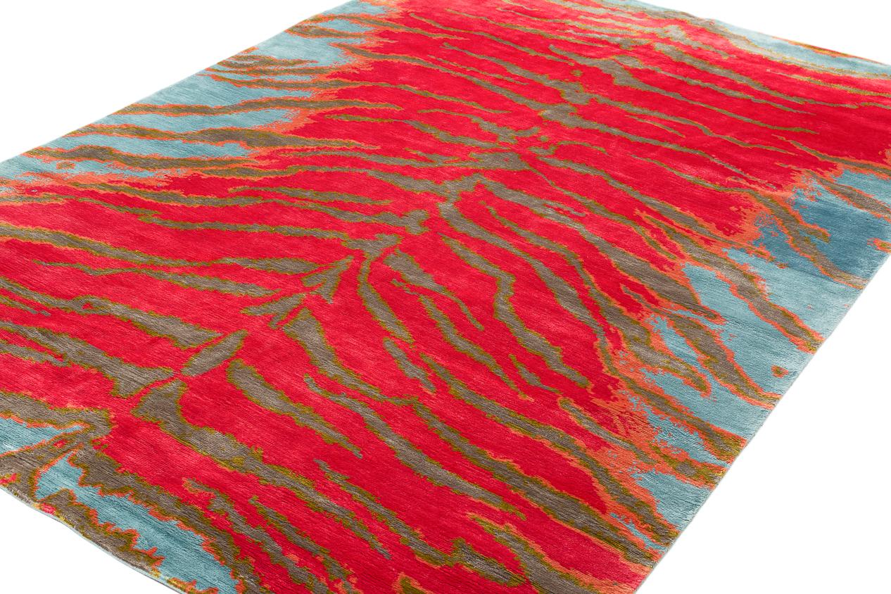 Tiger is a Joseph Carini carpets signature design that has been translated into countless color-ways. The Tiger Tropics design is shown in vibrant pinks and blues done in all natural dyes. Original design by Joseph Carini.