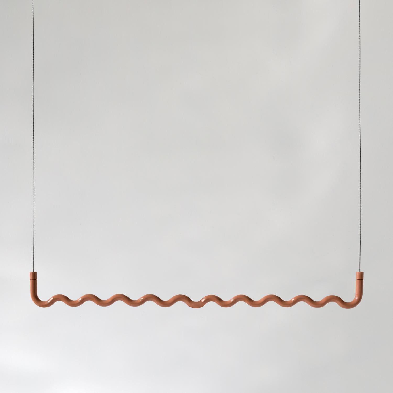 Sine Hanging Clothes Rack – Powder-Coated in Peach

Elevate your wardrobe organization with the Sine Hanging Clothes Rack in powder-coated Peach, a perfect fusion of functionality and contemporary design. Crafted from aluminum and finished in a