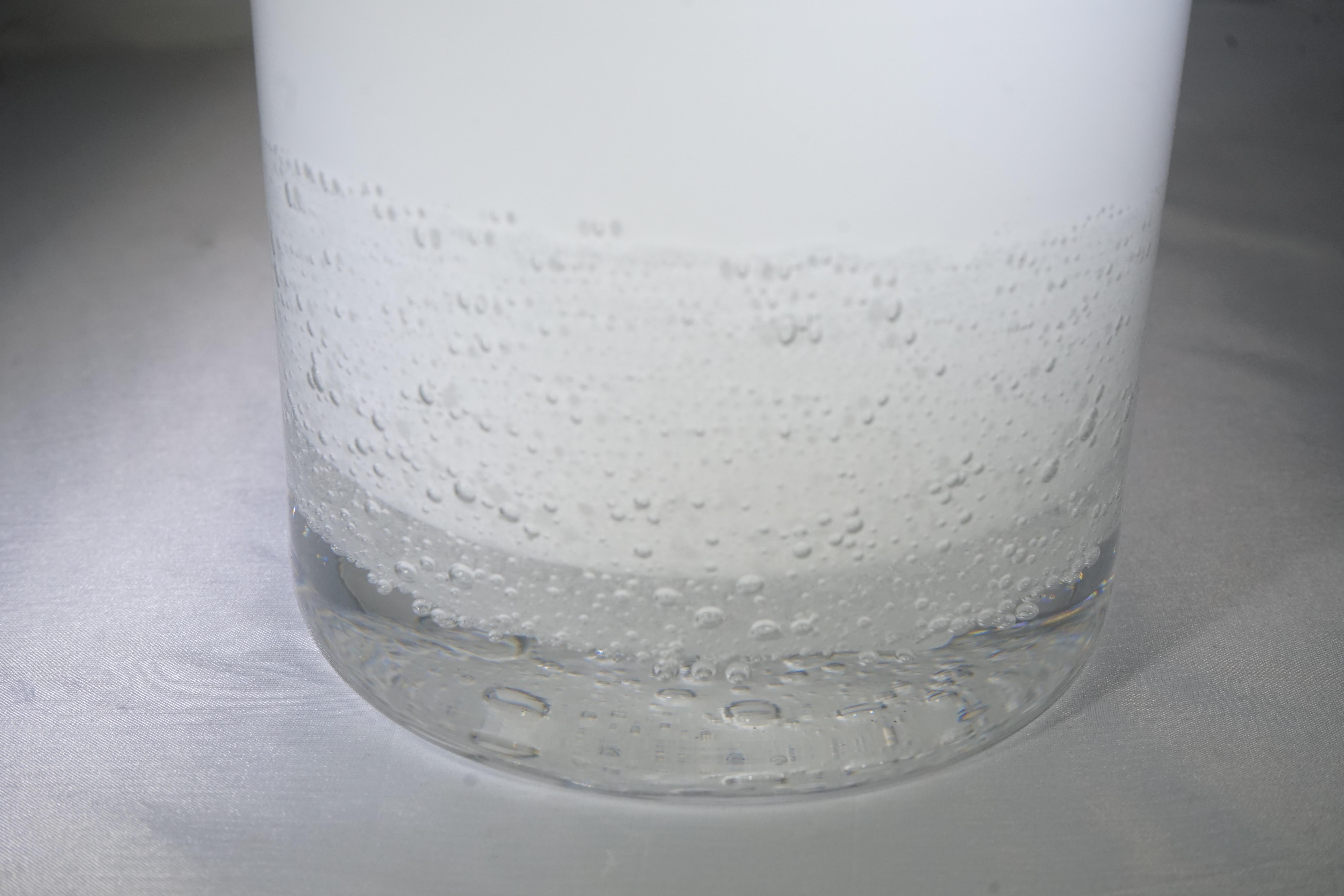 Contemporary large white glass hurricane lamp. Featuring 
