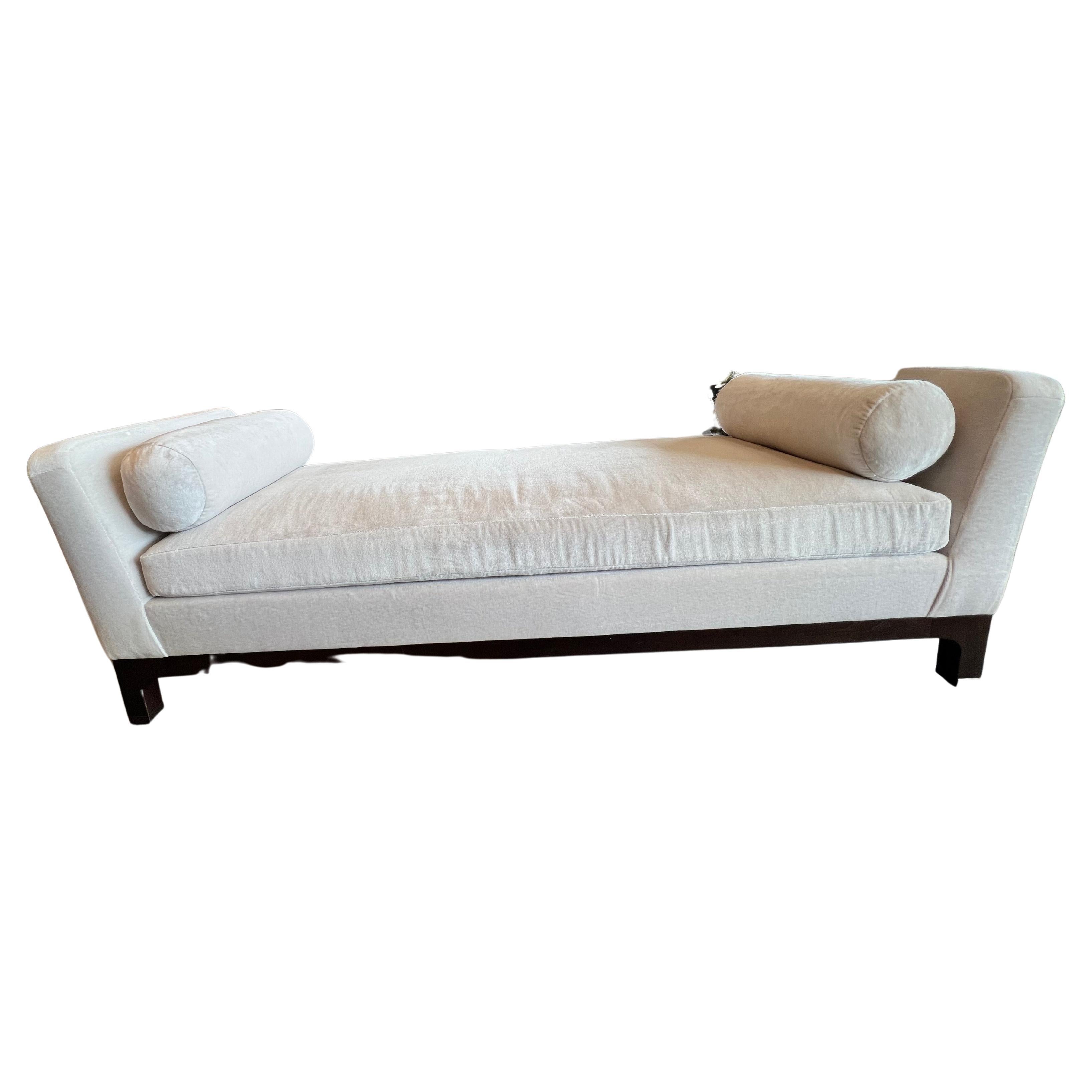 Contemporary Slipper Bench designed by Ralph Rucci for holly Hunt. The base and legs are made of walnut and bronze. The bench is unupholstered in a Holly Hunt acrylic fabric in Elephant grey.
 