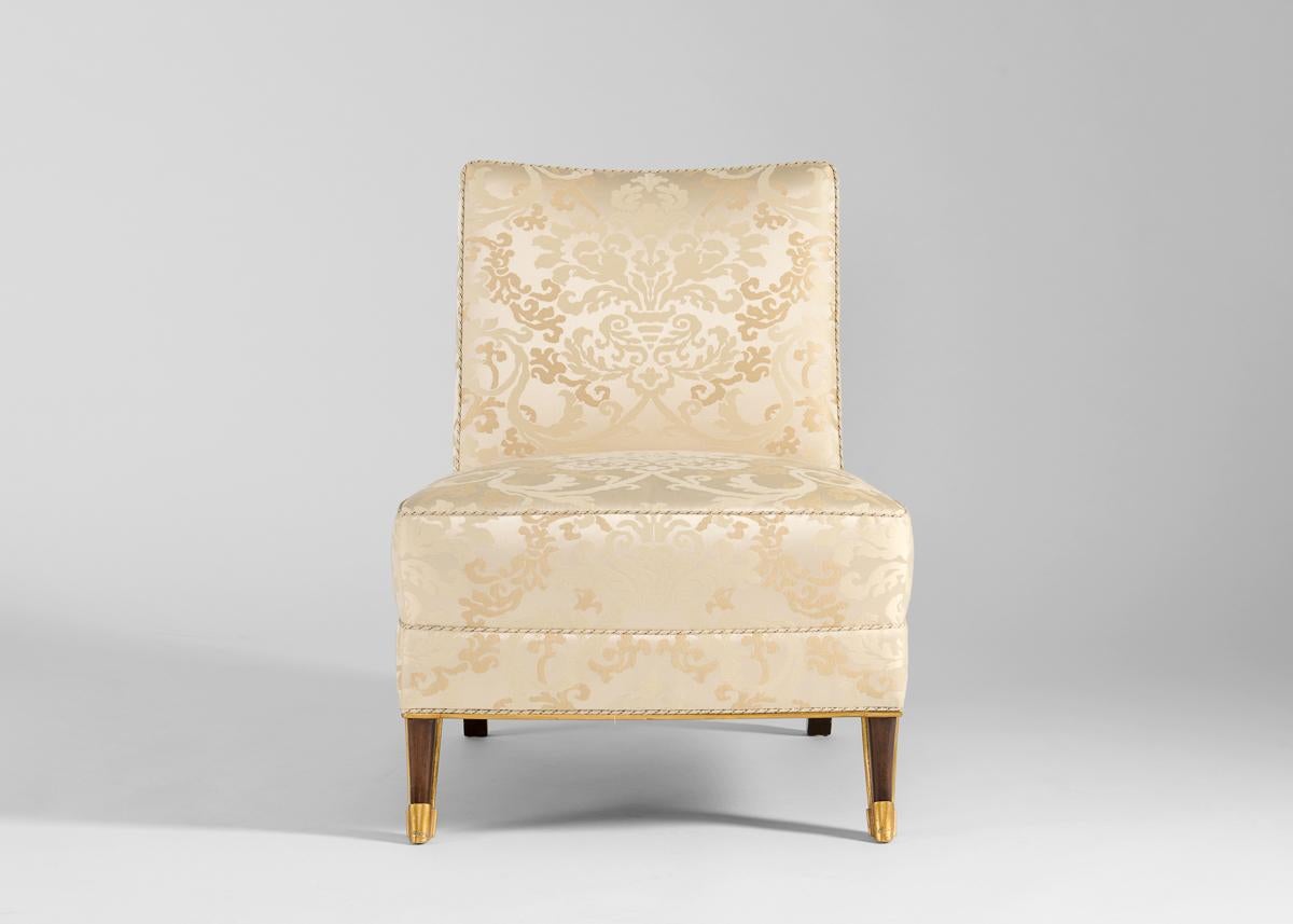 This pair of armless chairs of a recent manufacture is reminiscent of a design by JM Rothschild for various French ocean-liners including the SS Normandie. 
