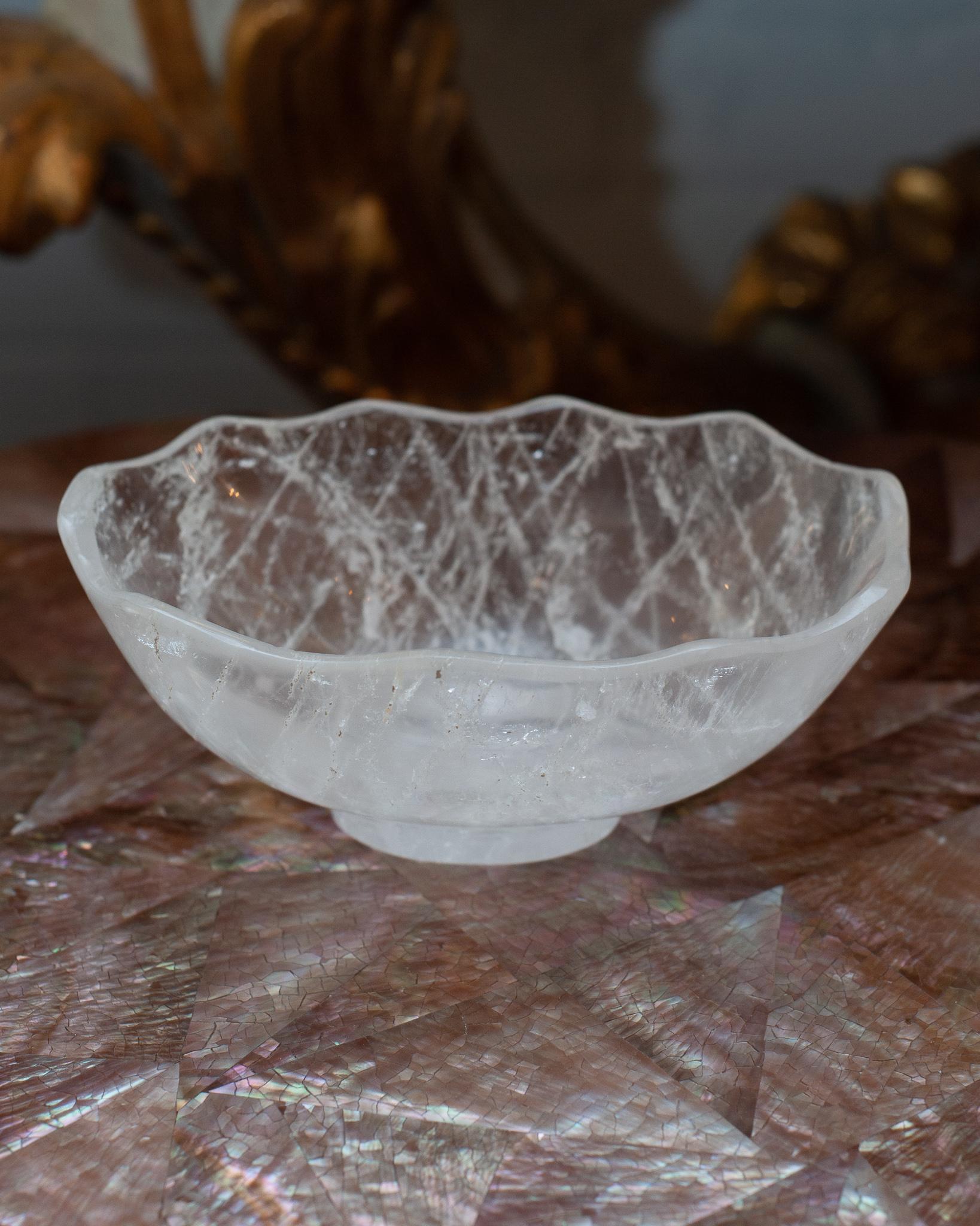 Bring the healing energy of rock crystal into your home with this beautiful carved bowl. This delicately carved bowl with a scalloped edge can filled with candies or kept sculptural as an empty vessel and placed in any space.