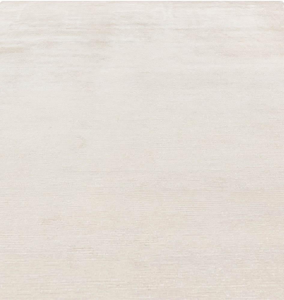 Contemporary solid beige wool Rug by Doris Leslie Blau.
Size: 6'0