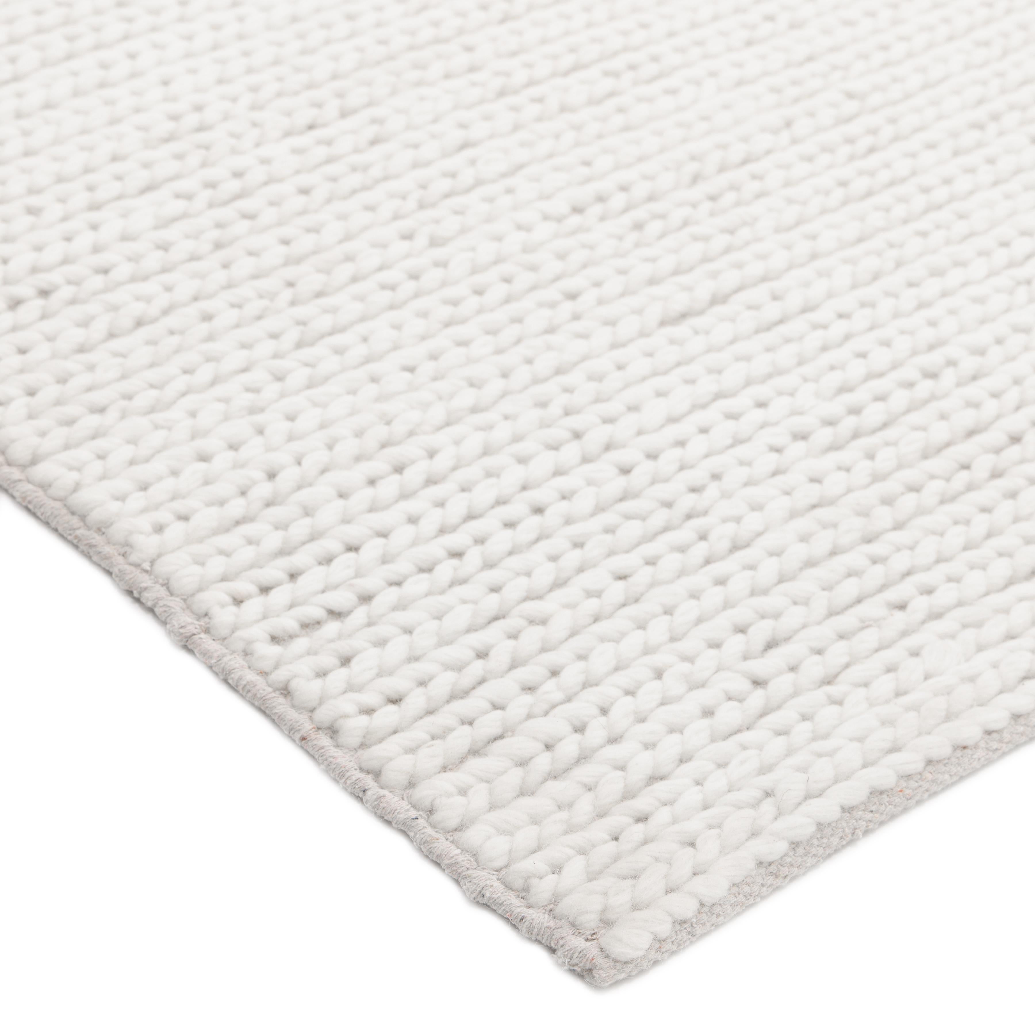 Subtle tone-on-tone stripes give the Solid collection a depth and sophistication all its own. These rugs can pull the disparate elements of a room into a beautifully cohesive whole; they can also introduce an unexpected but welcome jolt of color