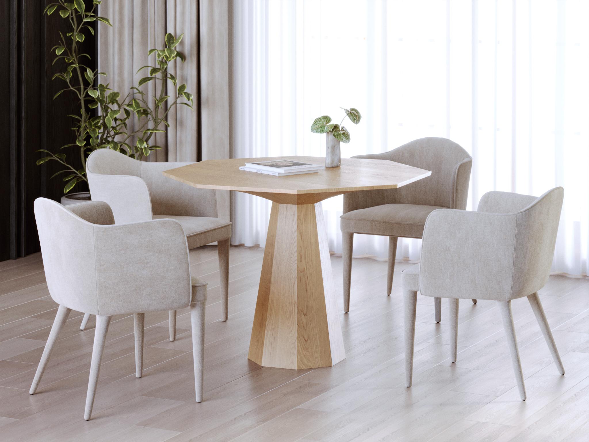 This contemporary dining table is crafted from solid oak in a natural finish, highlighting the authentic grain, warm tones, and timeless character of the wood. Its design is defined by bold geometric forms that add a sculptural presence, turning the