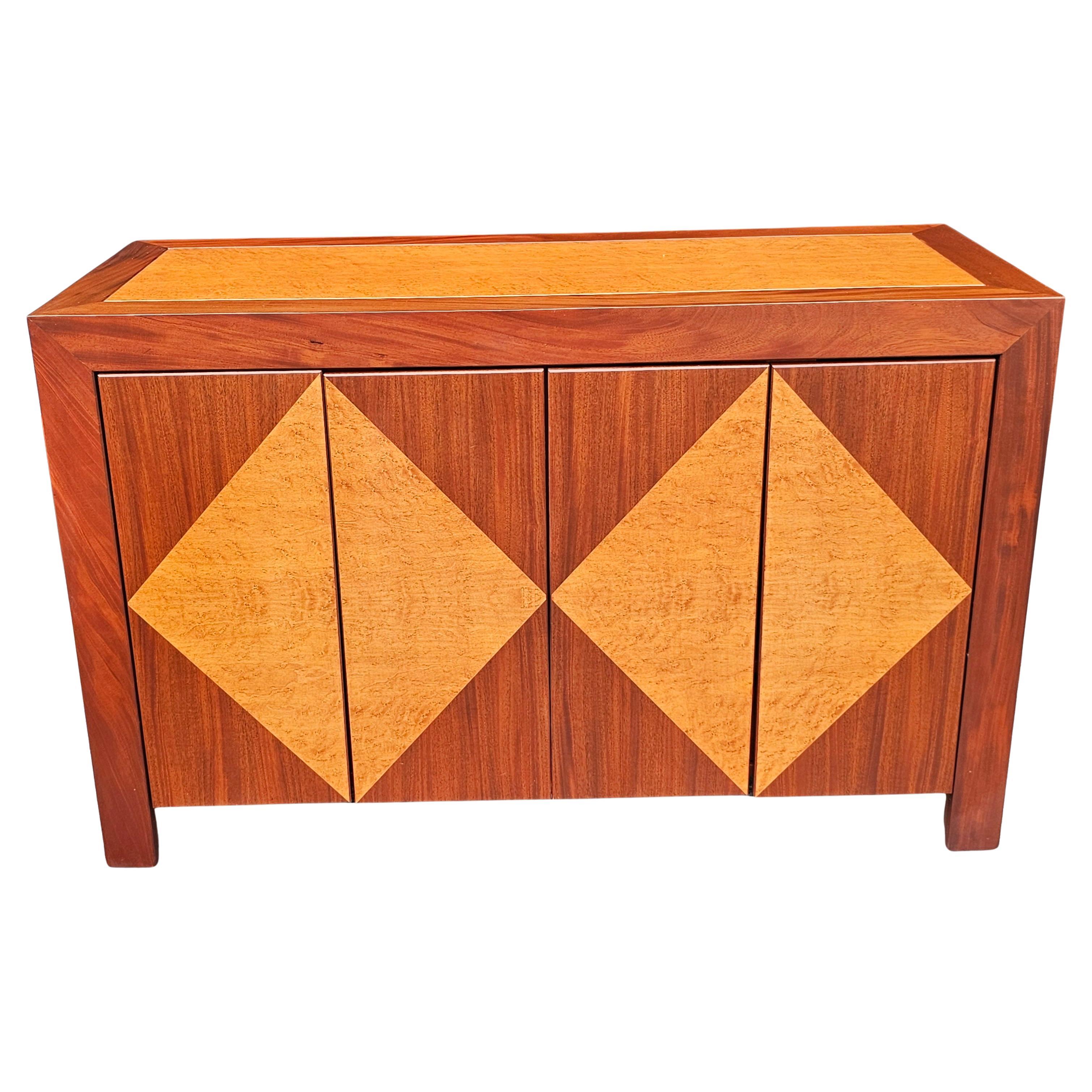 A clean Contemporary Solid Rosewood and solid Birdseye Maple Buffet / storage cabinet with clean lines.
Measures 52