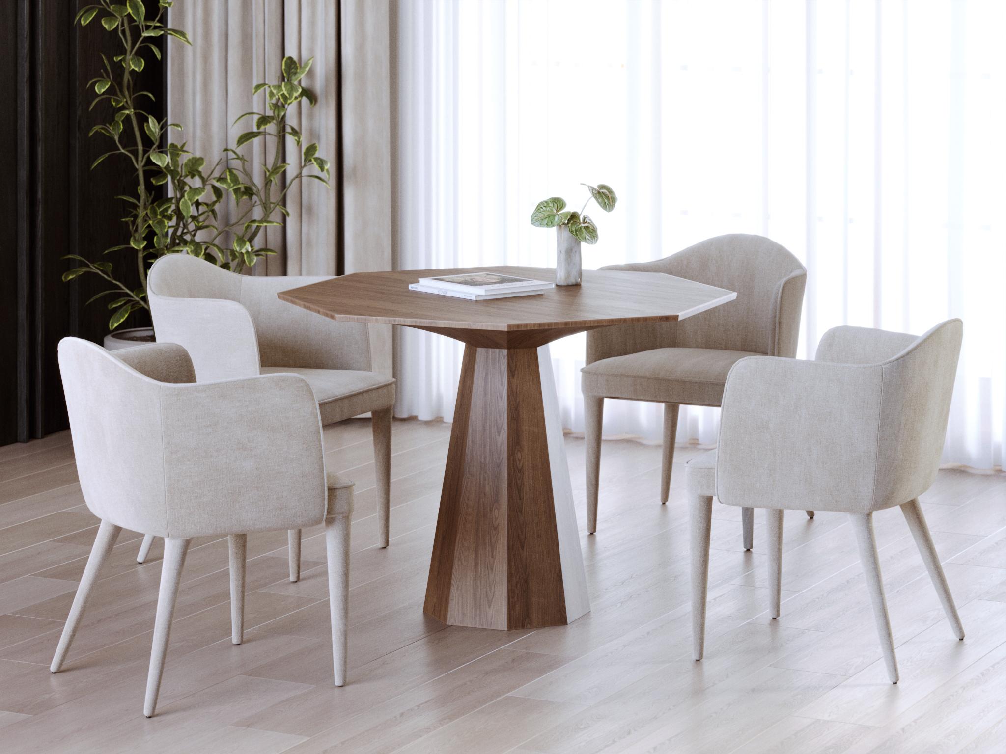 This contemporary dining table is made from solid walnut, showcasing the rich, warm tones and distinctive natural grain of the wood. Designed with bold geometric forms, it carries a sculptural quality that transforms it from a functional piece into