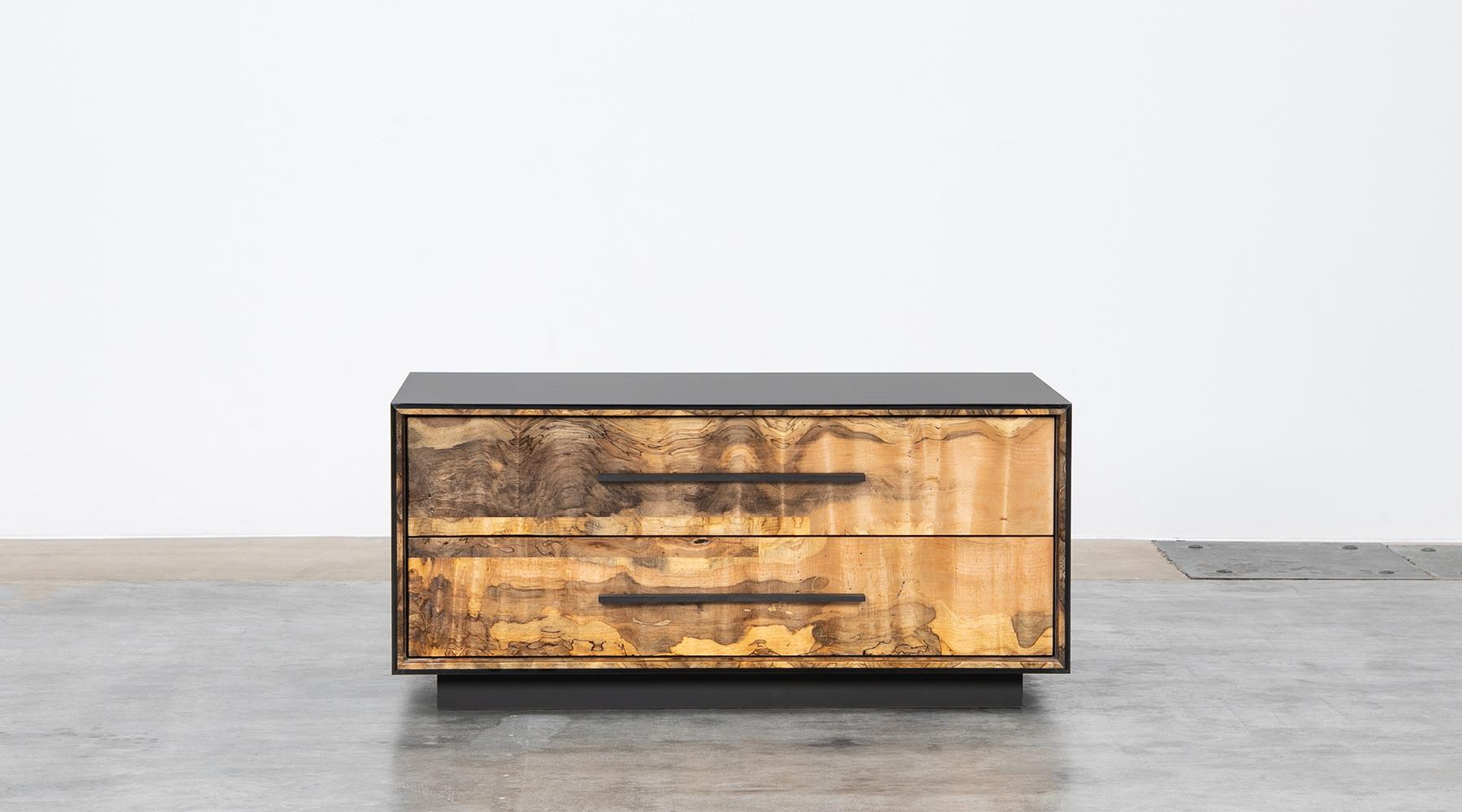 Dresser by contemporary German artist Johannes Hock. The Body is made of ultramatt HPL, the front of solid spalted beech with ebony handles. This piece features two soft-close drawers. Manufactured by Atelier Johannes Hock.

Spalted beech is wood