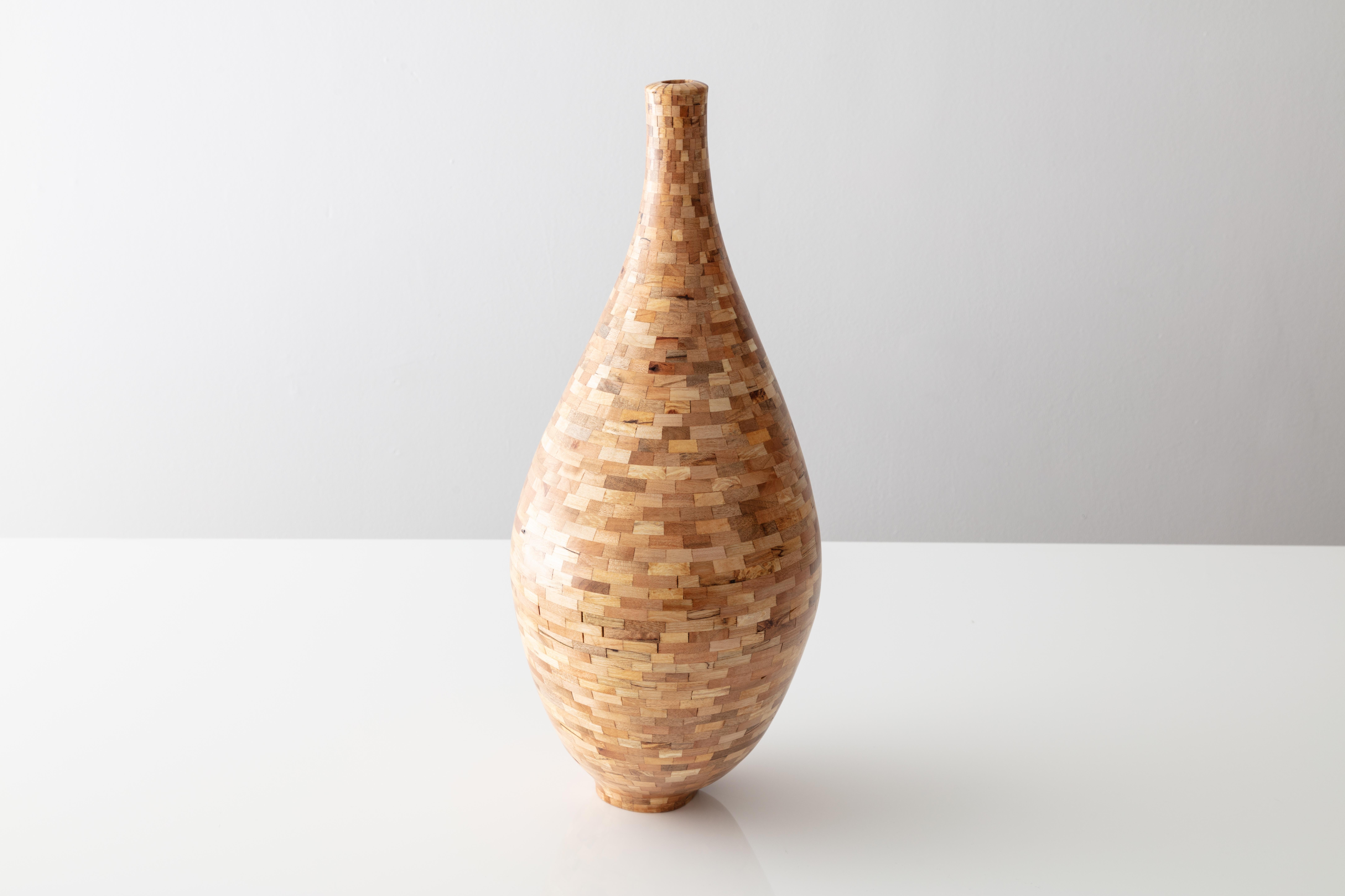 This asymmetrical vessel was created from salvaged Spalted maple. The wood's natural coloring shows off tones range all-over the place from yellow and blonde, to pink and deep browns with black striations and quilting throughout, kinda reminiscent