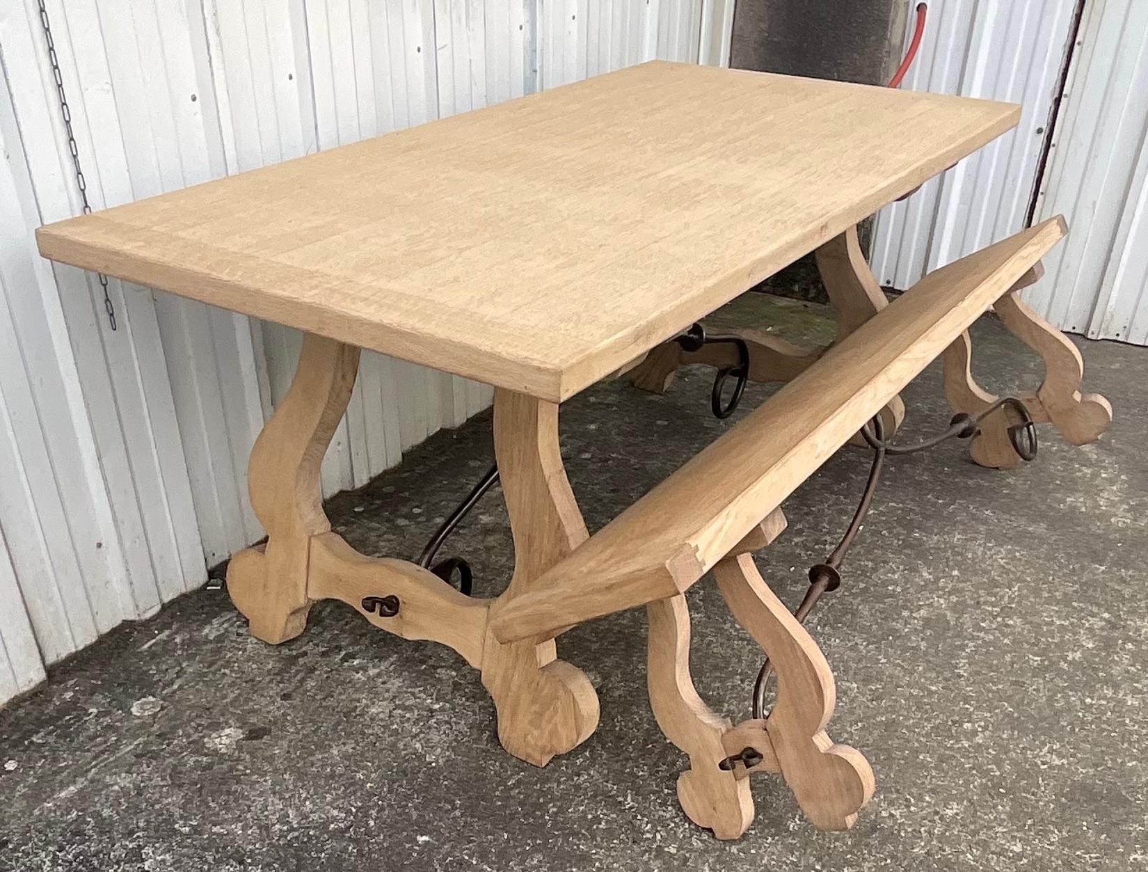 This exceptional set, composed of a large table and its matching bench, are characterful pieces originating from a former wine farm located on the banks of the Loire River. With a strong Spanish-inspired style, both pieces are crafted from solid