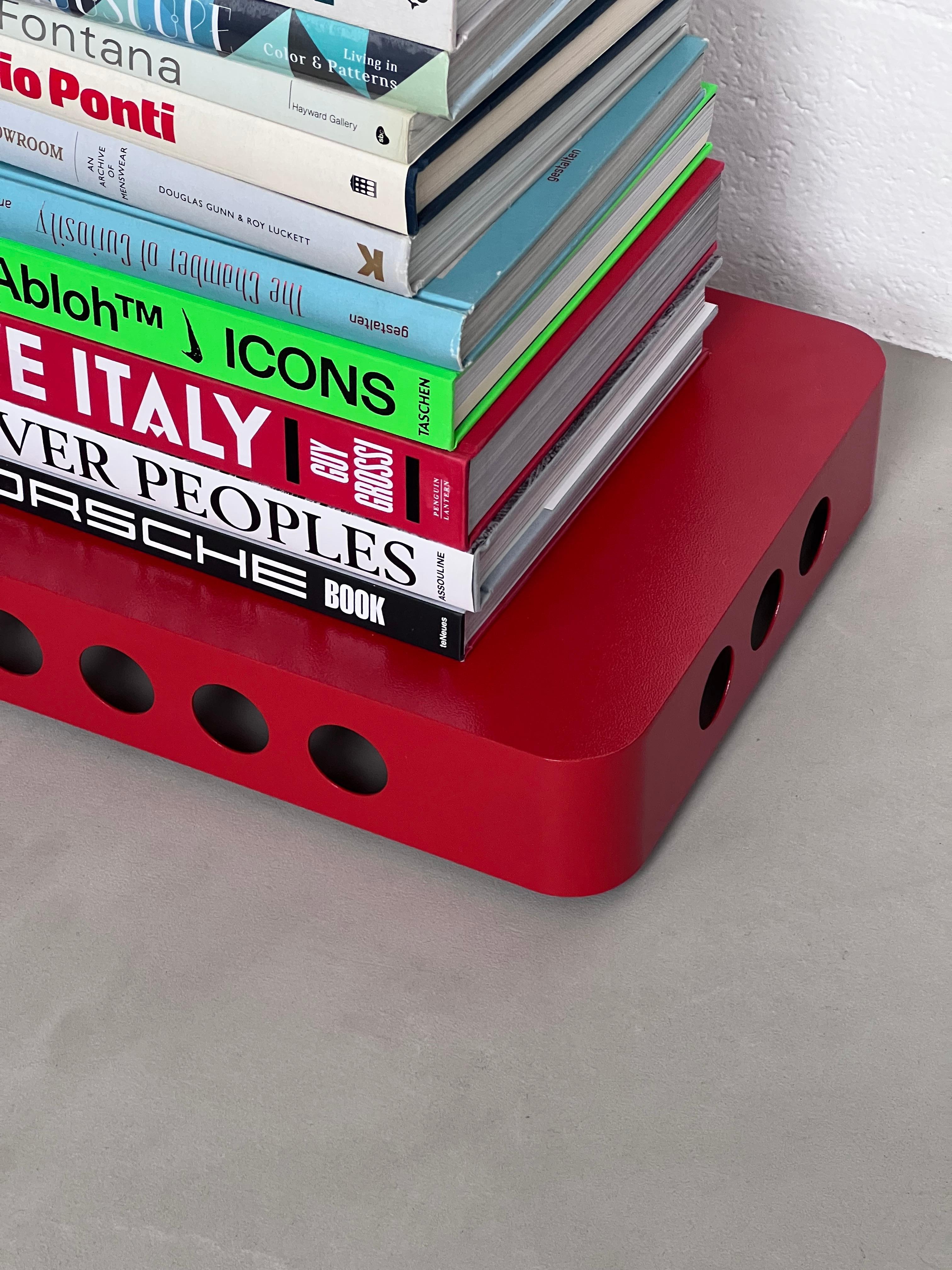 Modern Bookboard / side table by Spinzi, book shelf with wheels, bright red For Sale