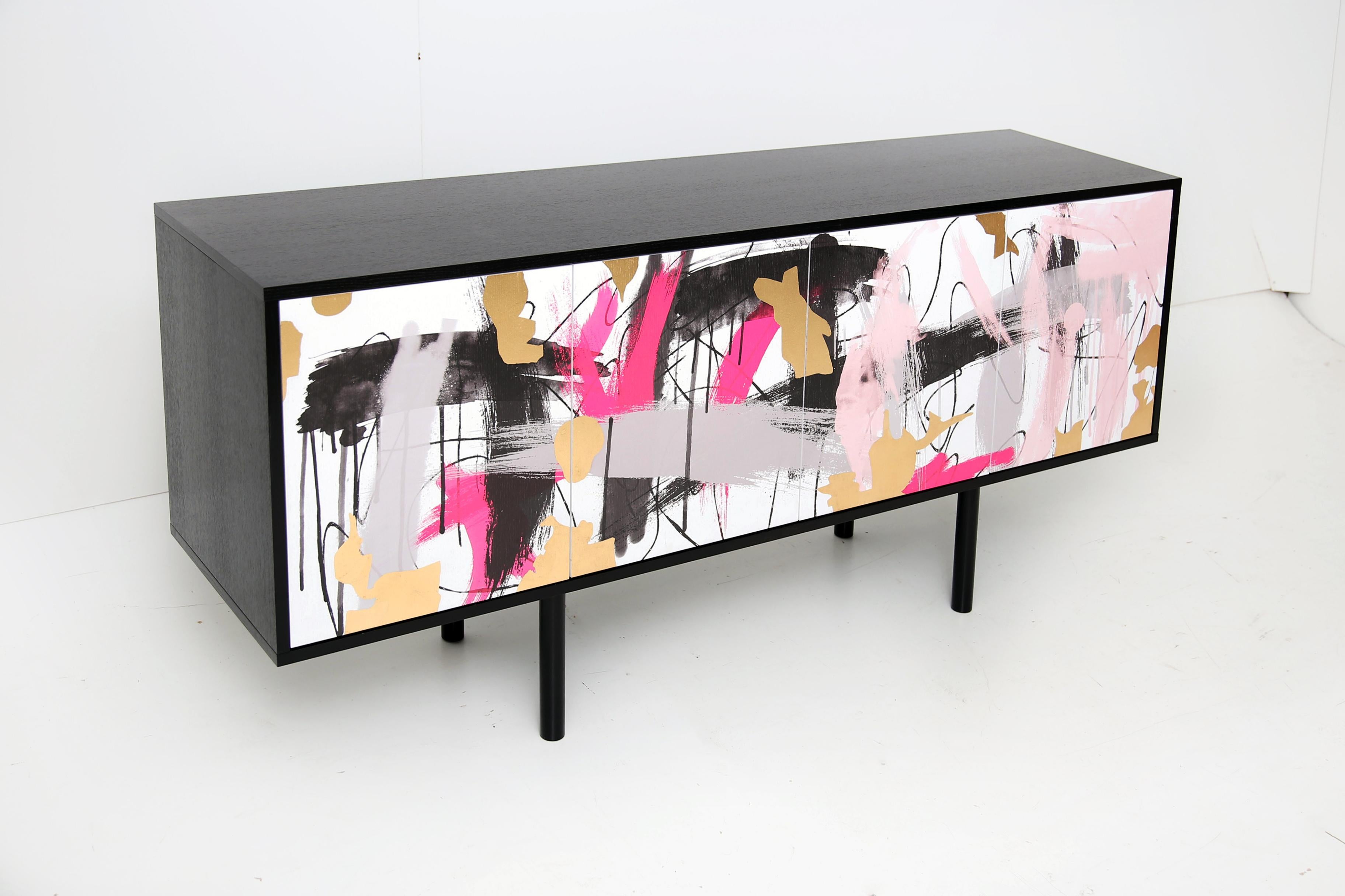 Worthy of its own award show! A modern mixture of function and style, the Splatter media console features clean lines, a uniquely mixed media finish, and plenty of media space. The Splatter Sideboard will fit in and stand out perfectly within your