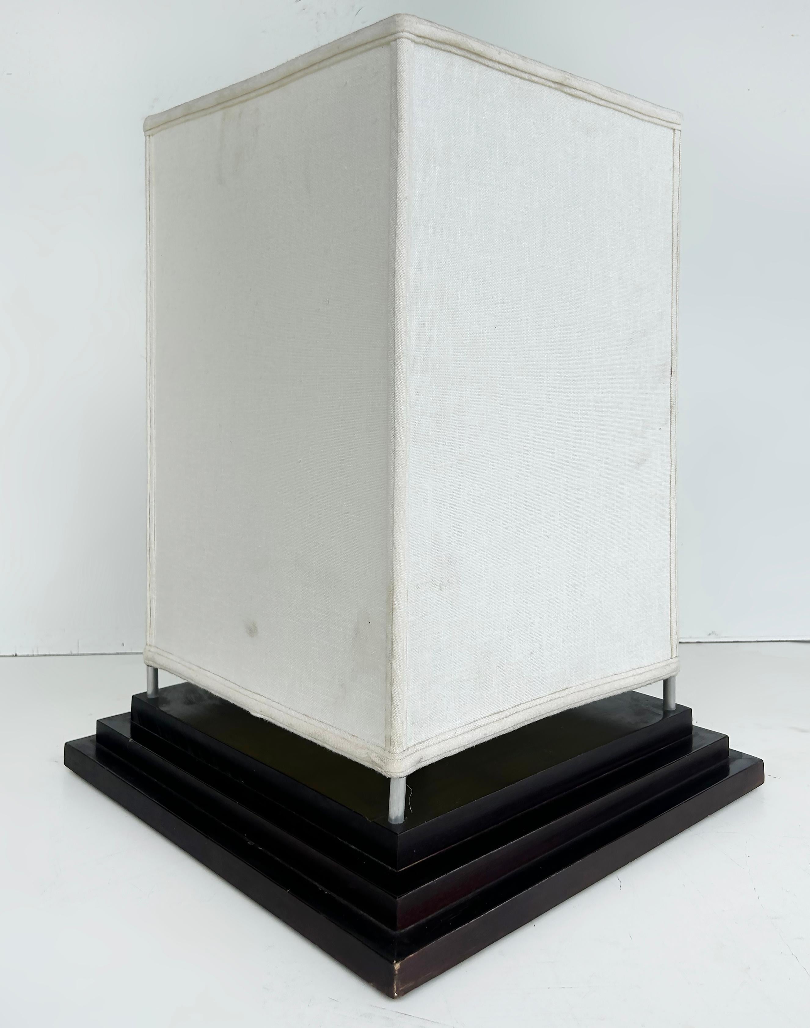 Contemporary Square Fabric Table Lamps on Wood Bases, Pair, Wired and Working

Offered for sale is a pair of fabric column table lamps on square stepped wooden bases.  The lamps will illuminate areas nicely as mood lighting.  The fabric is original