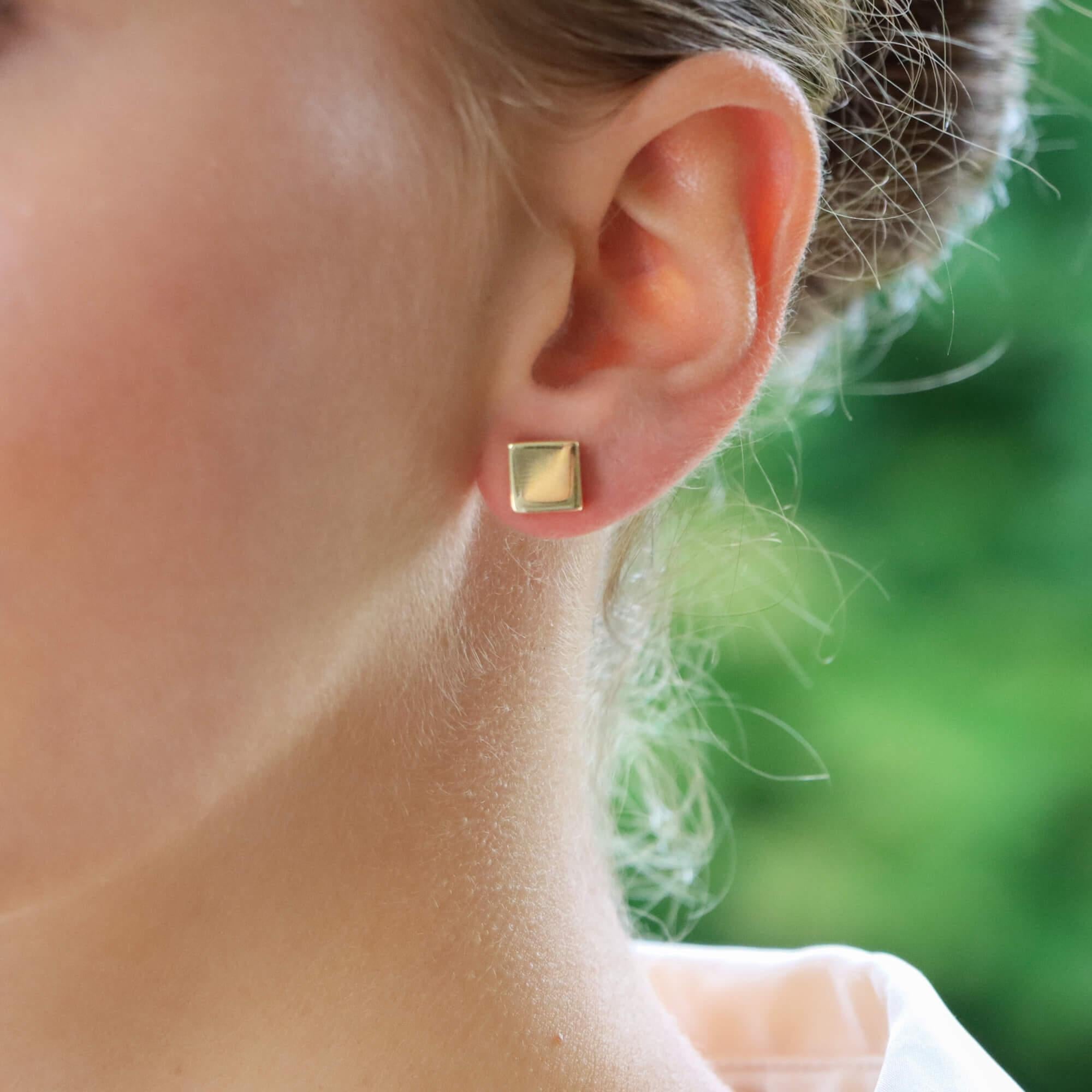 A highly unique pair of contemporary square earrings set in 18k yellow gold.

Each earring is composed of a cubed motif and are made of polished yellow gold which look fantastic once on the ear. Both are secured to reverse with a post and butterfly