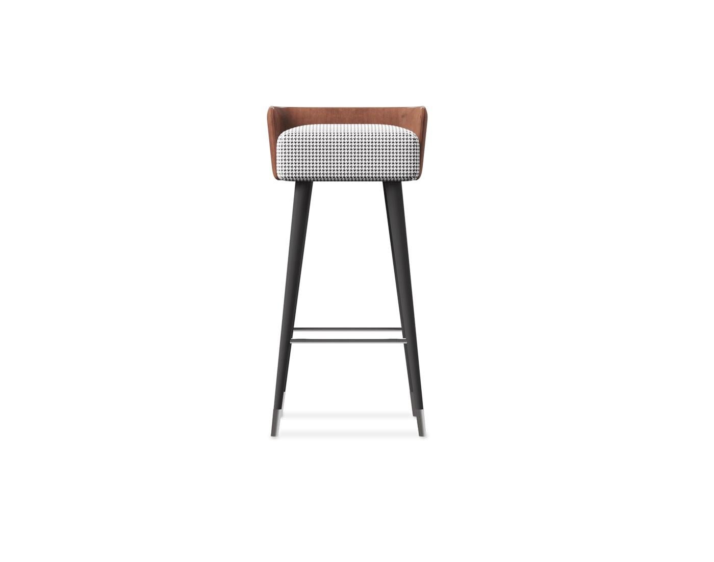This barstool combines elegance and functionality with its thoughtfully crafted design. The legs feature a sleek lacquered finish, enhancing its modern aesthetic, while the backrest is upholstered in high-quality leather for a touch of