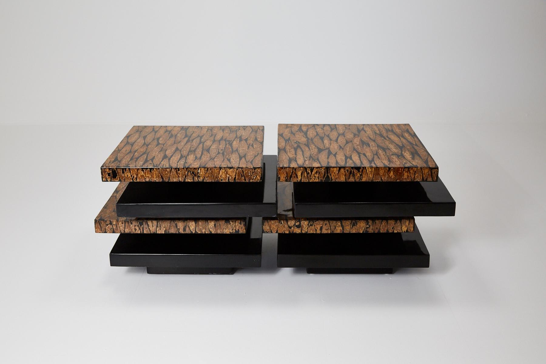 Contemporary lacquered coffee table comprised of stacked rectangular forms, alternating between plain black gloss and cotton husk inlay finishes. The table is in two parts and can be used together as a coffee table or separately as side
