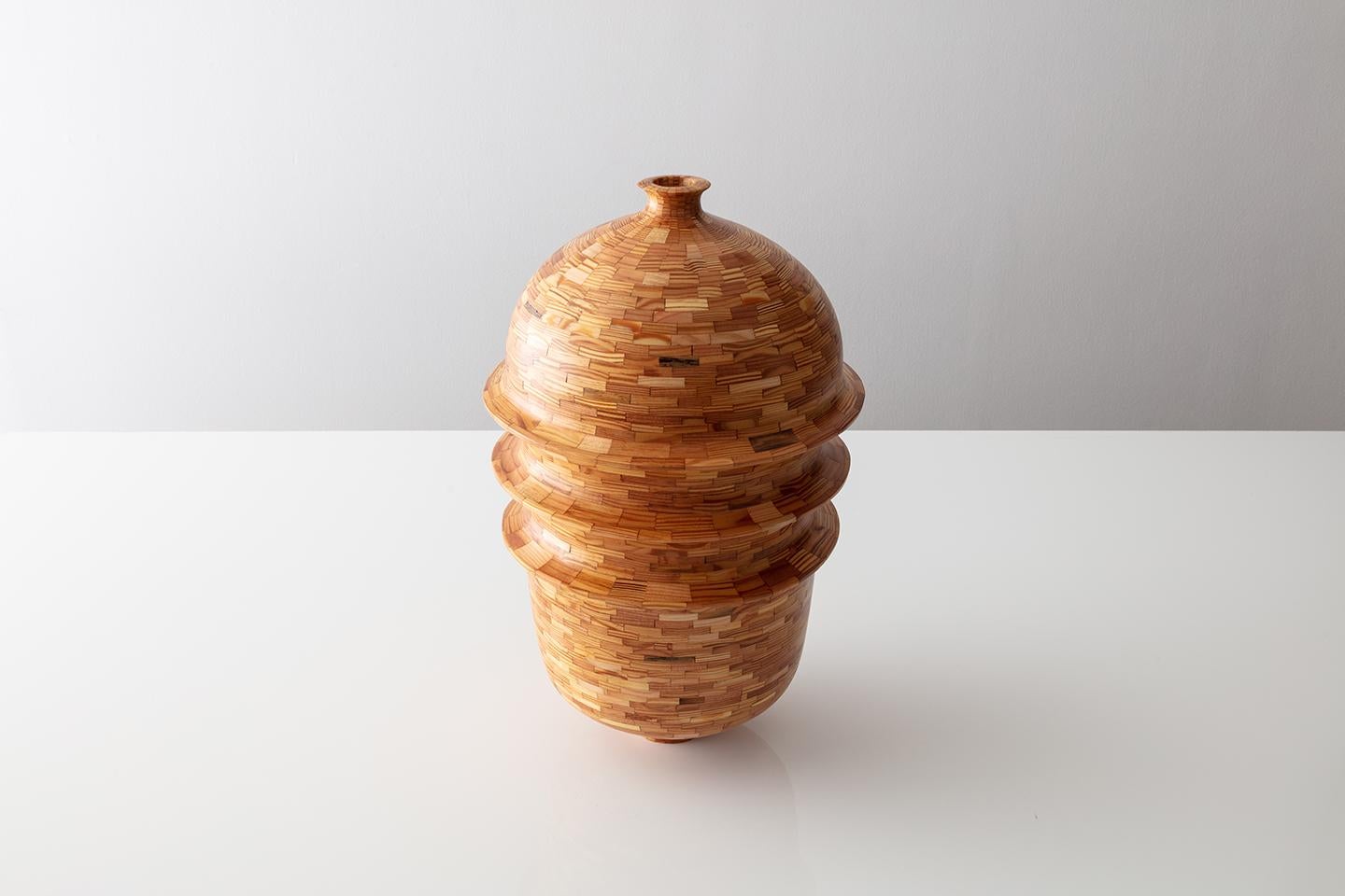 Part of Richard Haining's STACKED Collection, this Three Ringed Vase was made using reclaimed Heart Pine from building joists salvaged from a gutted Brooklyn Brownstone's. These NYC Brownstone’s are all Pre-War, built in the late 1800’s which in