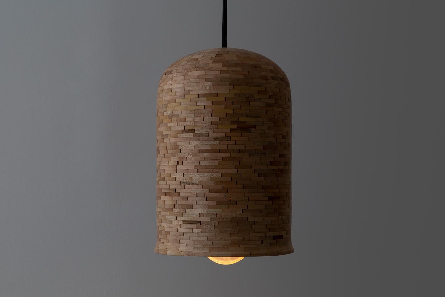 The STACKED cylindrical bell-shaped Illuminated Hanging Sculpture shown here is made of salvaged Maple. All Illuminated Sculptures are hand-built custom per your specifications. Larger or smaller, used individually or as a grouping, a different