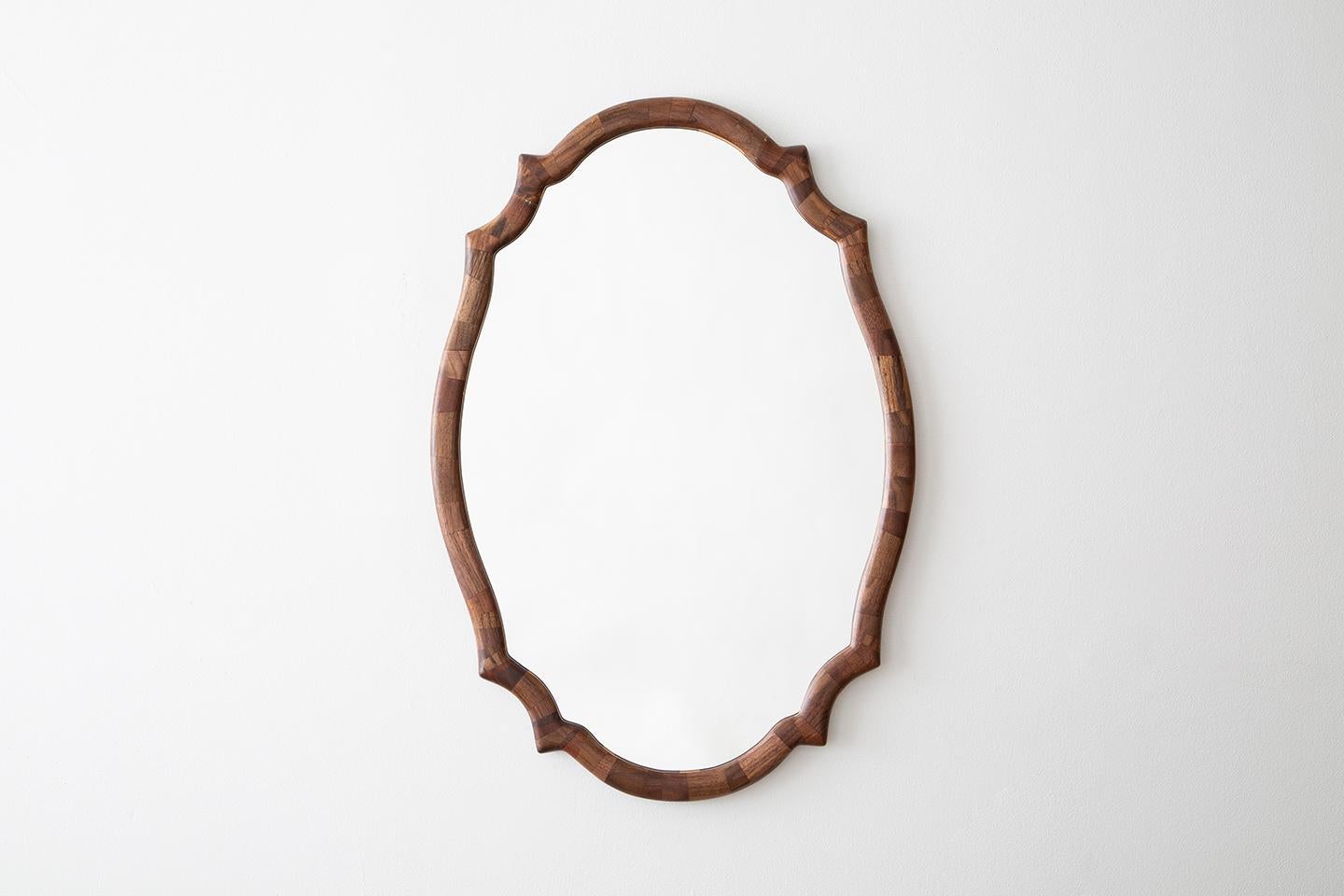 Part of Richard Haining's STACKED collection, the frame of this scalloped mirror is shown both in reclaimed mahogany as well as salvaged walnut, but is 