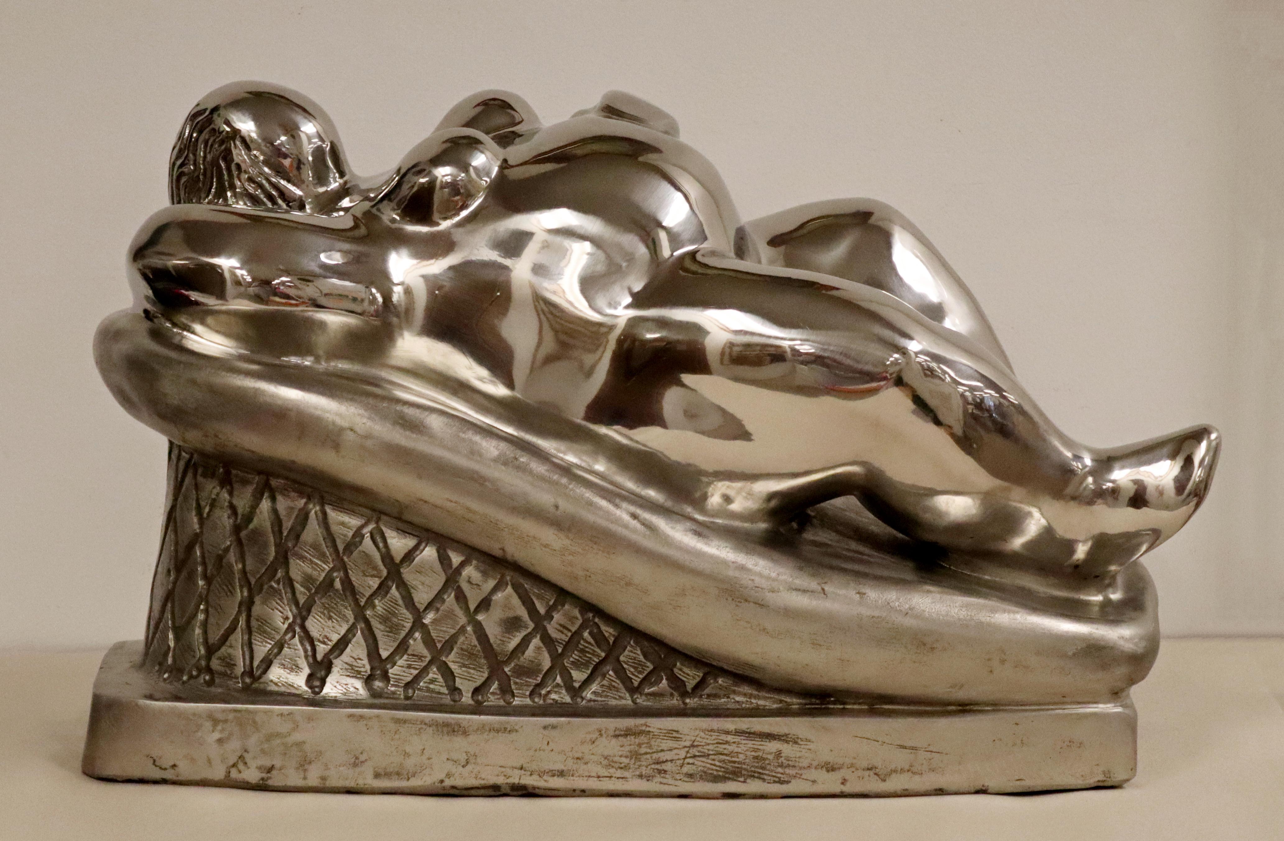 For your consideration is a magnificent, stainless steel table sculpture, of a reclining nude woman, 