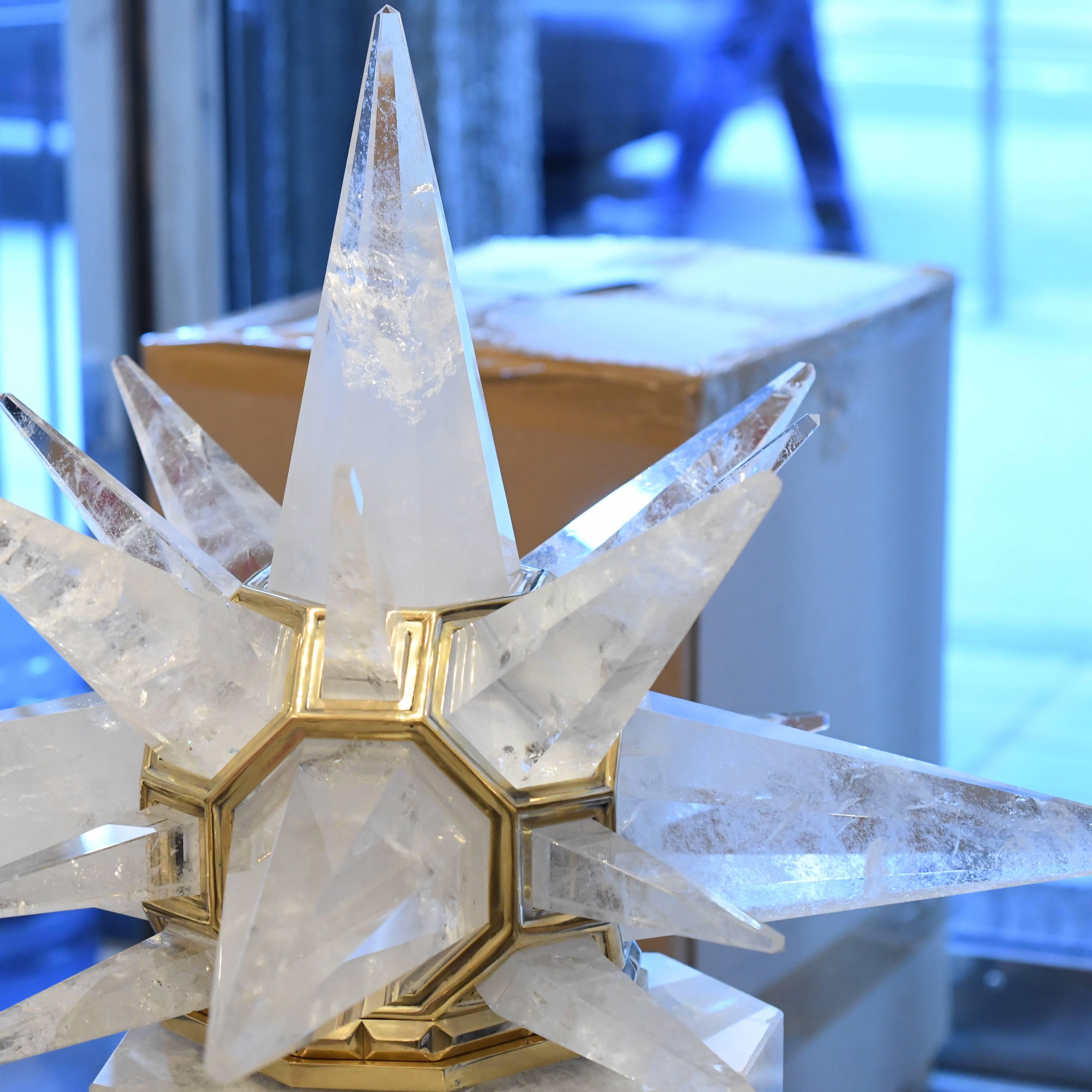 A fine carved star form rock crystal flush mount with polished brass finished frame, created by Phoenix Gallery, New York City.
 
For more Rock Crystal lightings and accessories from Phoenix gallery, please search 