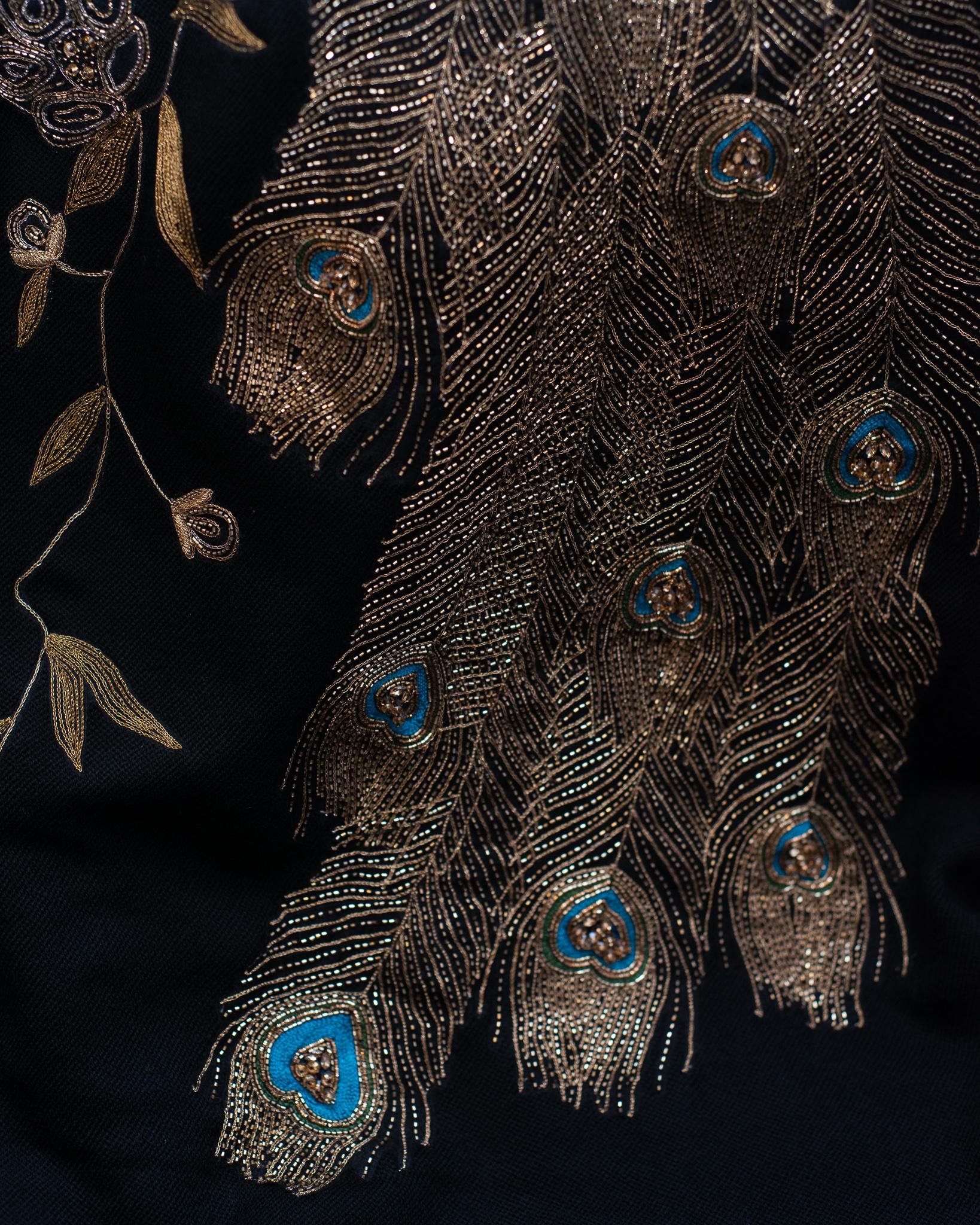 Just landed: Statement Peacock wool throw blankets, ornately hand embroidered with metal thread and fine beading. Comprised of 100% merino wool, these blankets are as soft as they are luxurious. Embroidered on one side and raw edge finish.