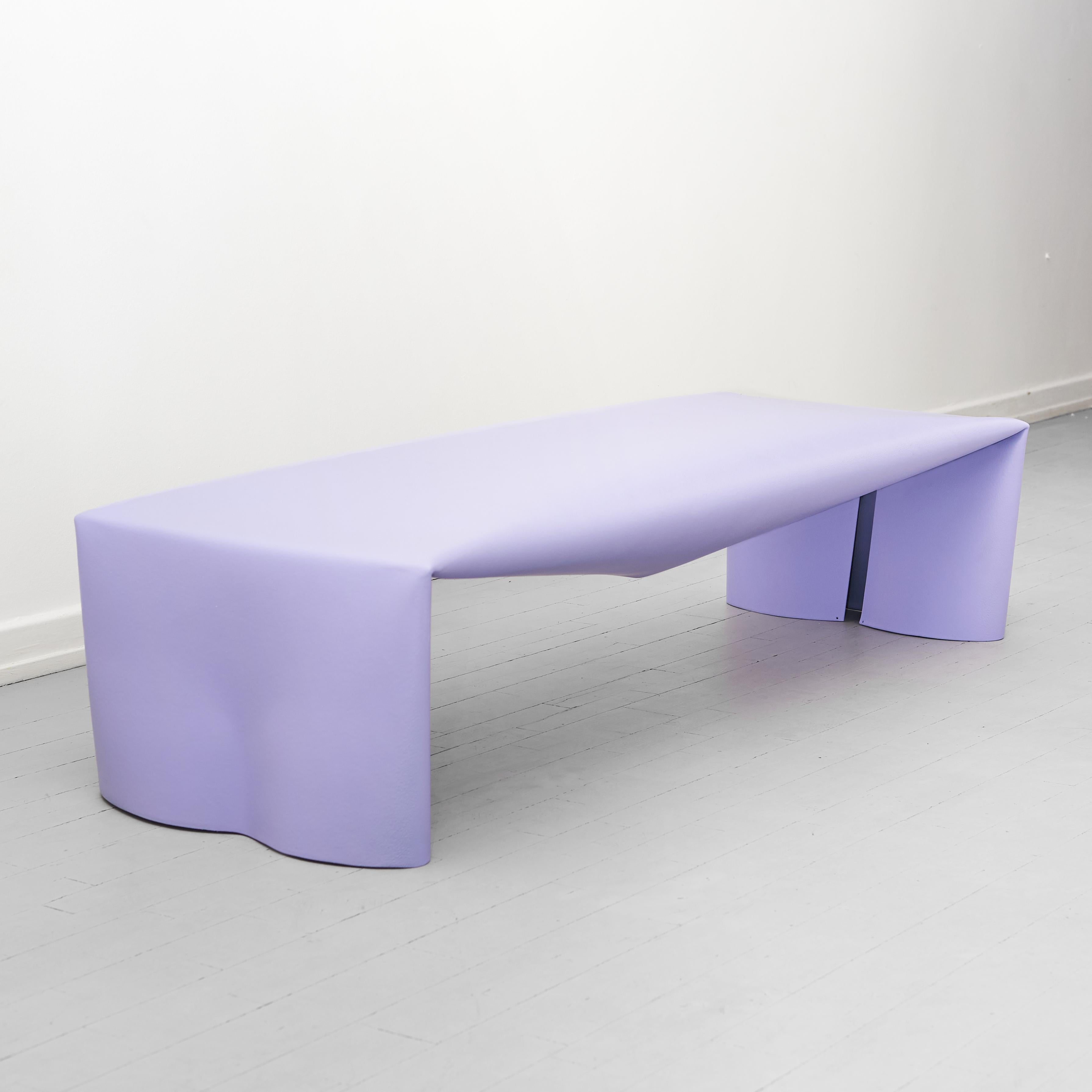 The steel bench is a monolithic steel form created from a combination of a few simple actions. Working with a bespoke metal fabrication company, a flat sheet of steel is manipulated in three operations: it is rolled into a tube, pressed flat and the