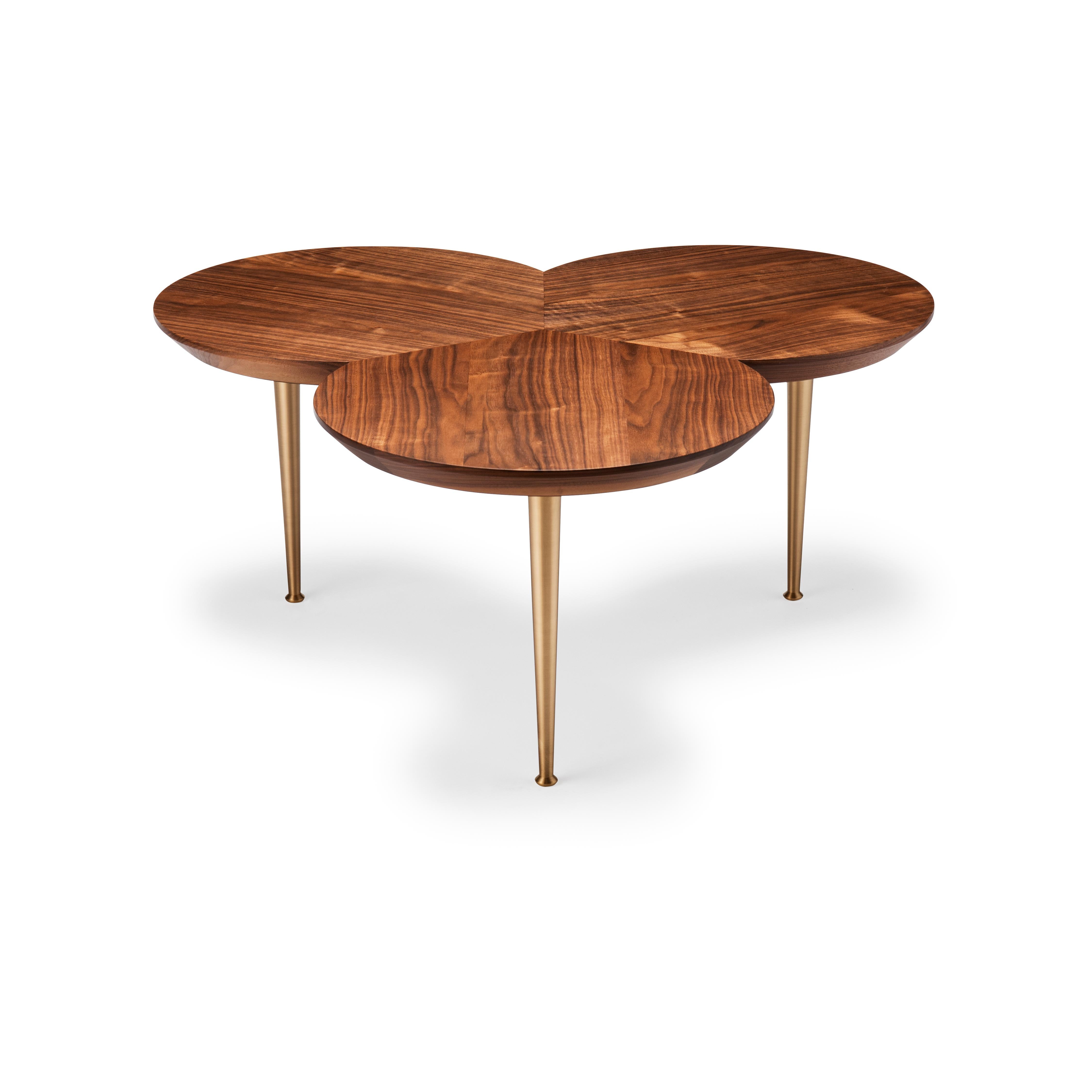 With its trefoil shaped top featuring Directional veneer and elegant stem like solid brass legs, this table can integrate or stand alone as a quiet piece of elegant design.

Shown here: in natural oiled walnut and brass. The top is made from solid