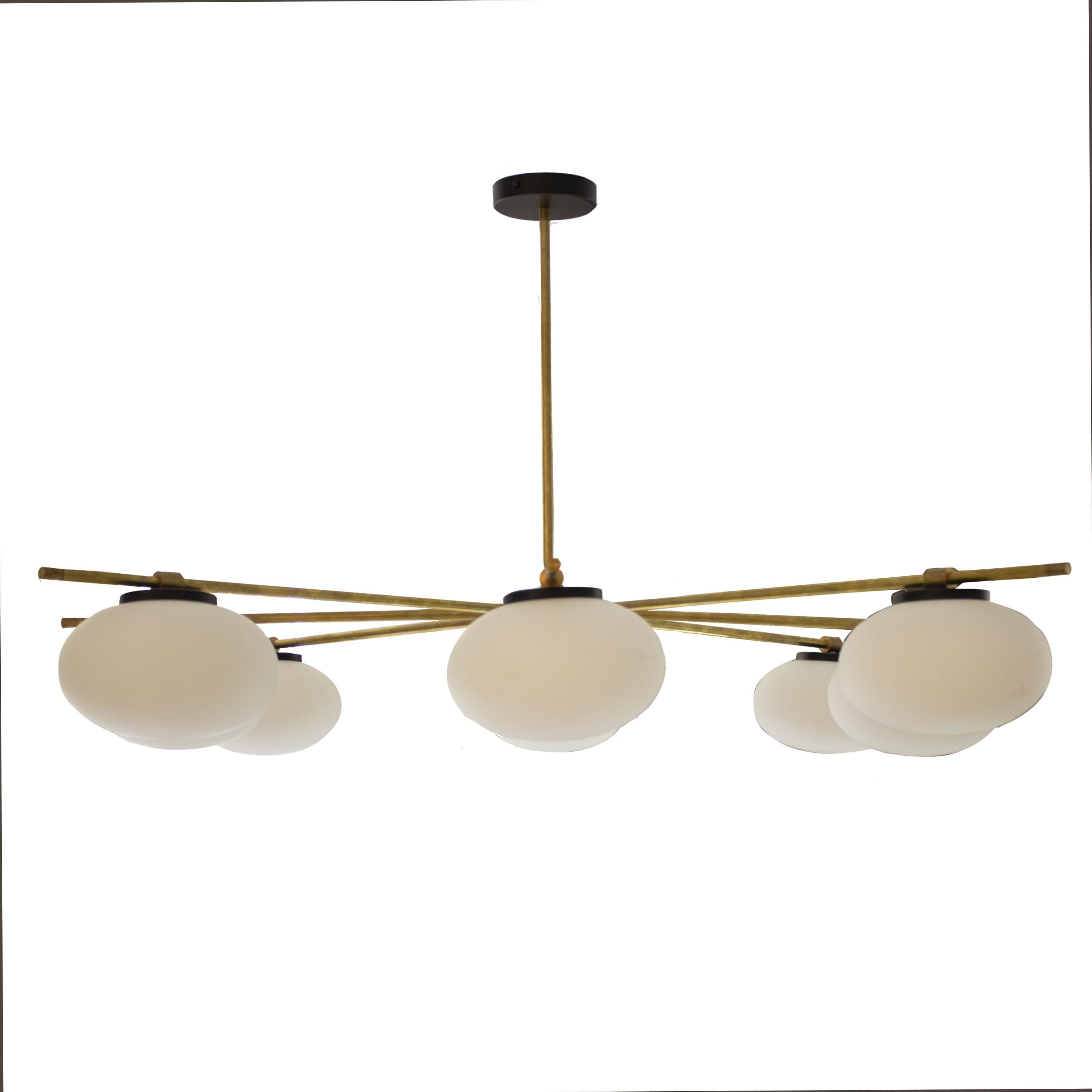 Contemporary suspension lamp in the style of Stilnovo designed by IKB191. 
It consists of a radial brass structure of eight tube arms and eight oval white glass light bulbs. 
Bulb size: 15 cm diameter, 13 cm Hight.


