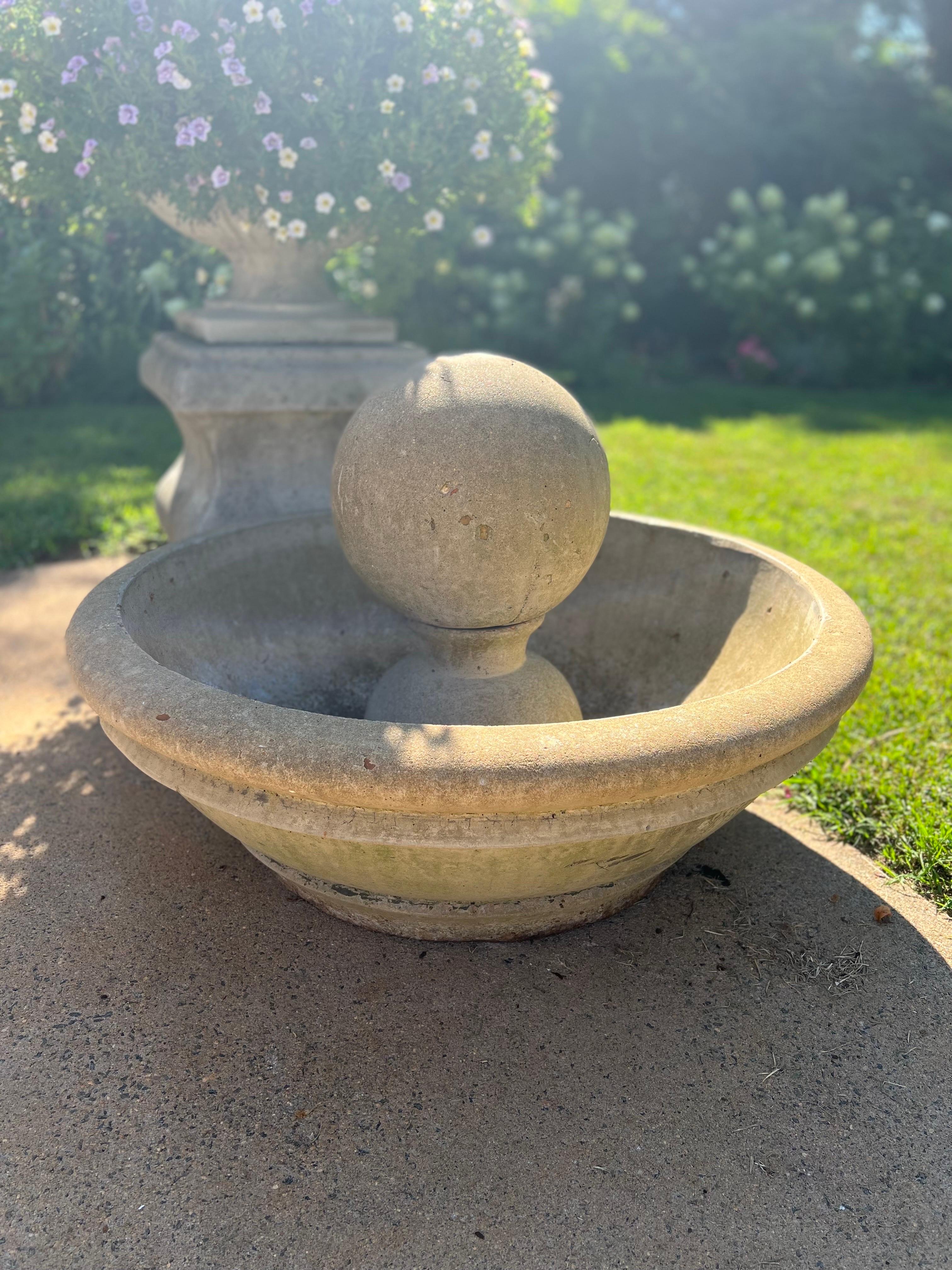 Beautiful contemporary fountain. Round floor basin with stone ball. 
Imported from France in the early 2000's.
Measurements detailed in the listing.