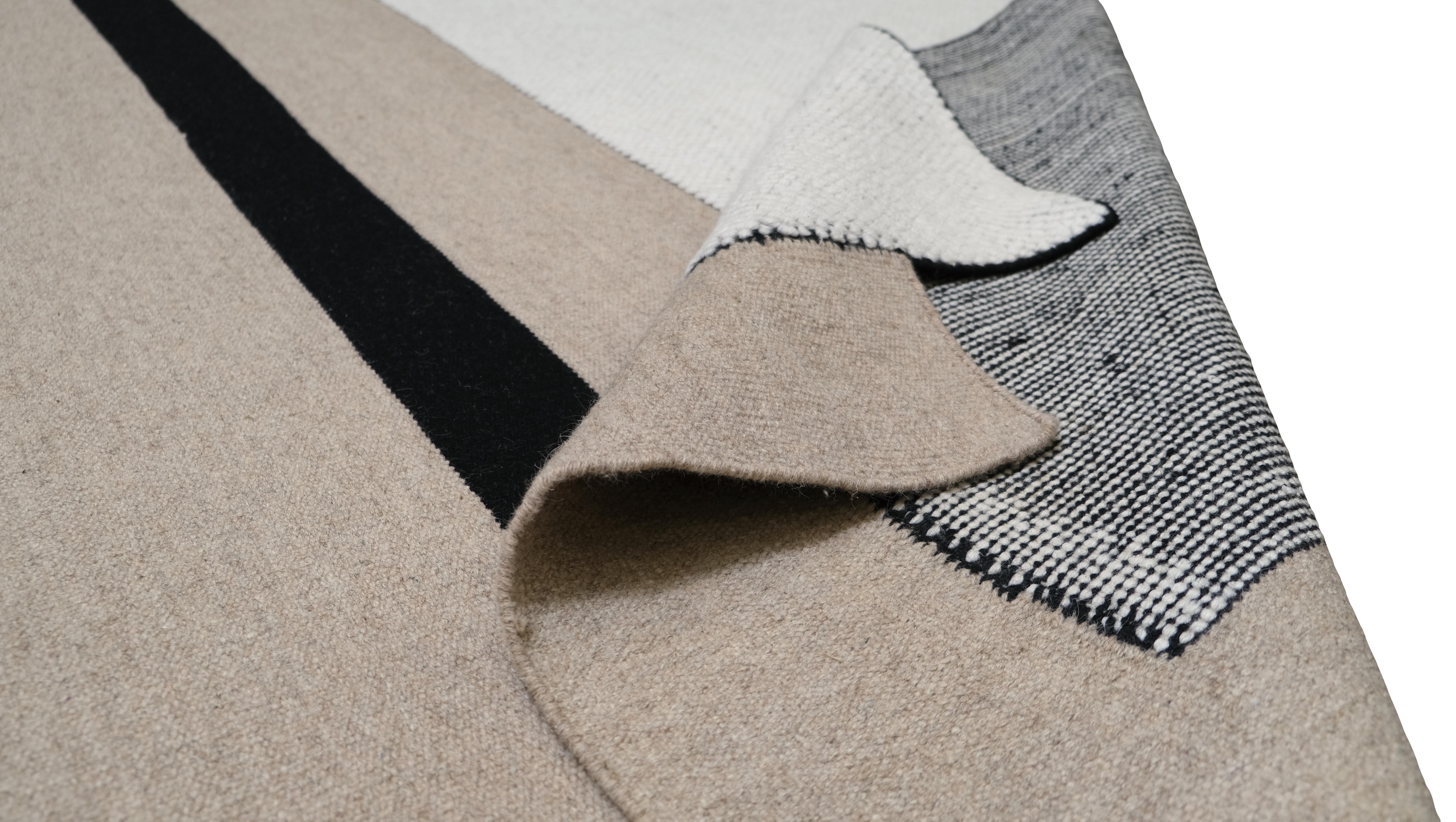 This rug’s sleek geometric composition exudes contemporary elegance, making it the perfect centrepiece for modern, Scandinavian, or minimalist interiors.
Handcrafted by skilled artisans using premium wool, this rug is as durable as it is stylish.