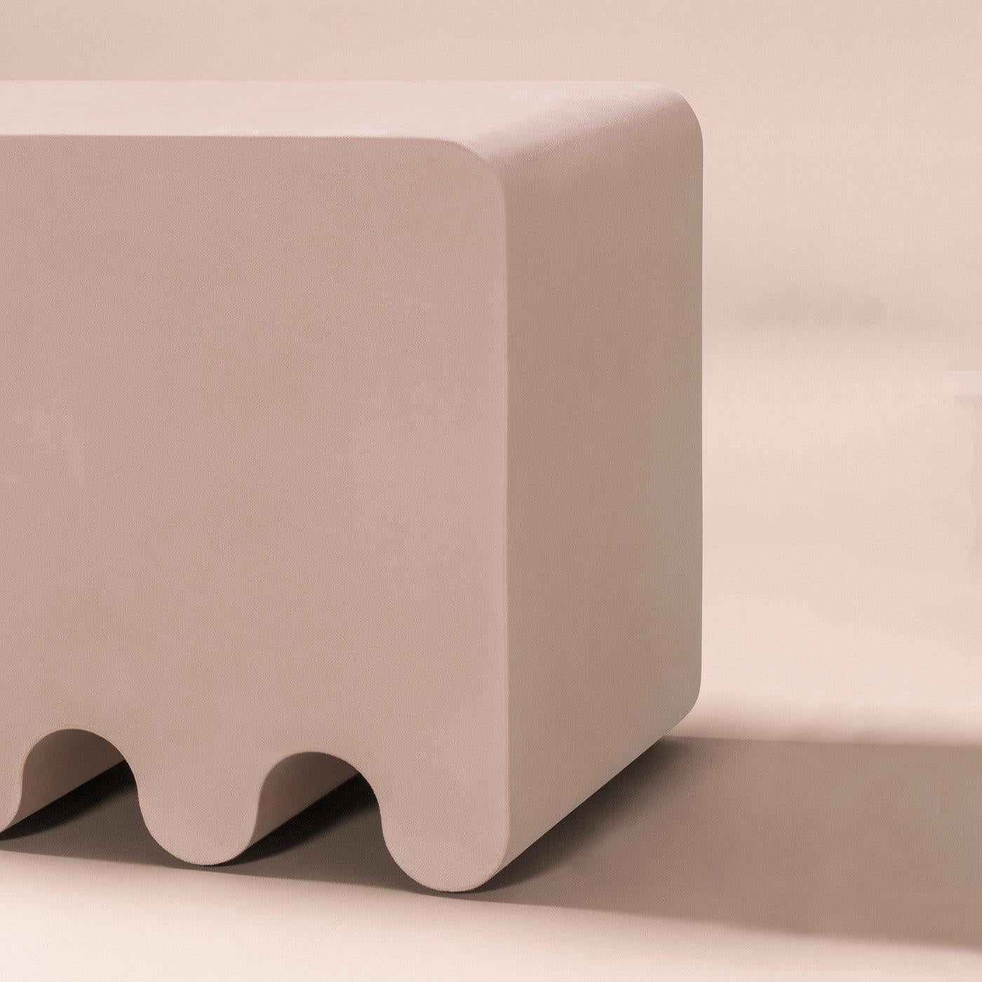 Contemporary suede leather stool - Ossicle by Francesco Balzano for Giobagnara.
The object presented in the image has following finish: A91 Nude Suede Leather.

An iconic piece from the Ossicle Collection of benches, seats, and tables, this pink