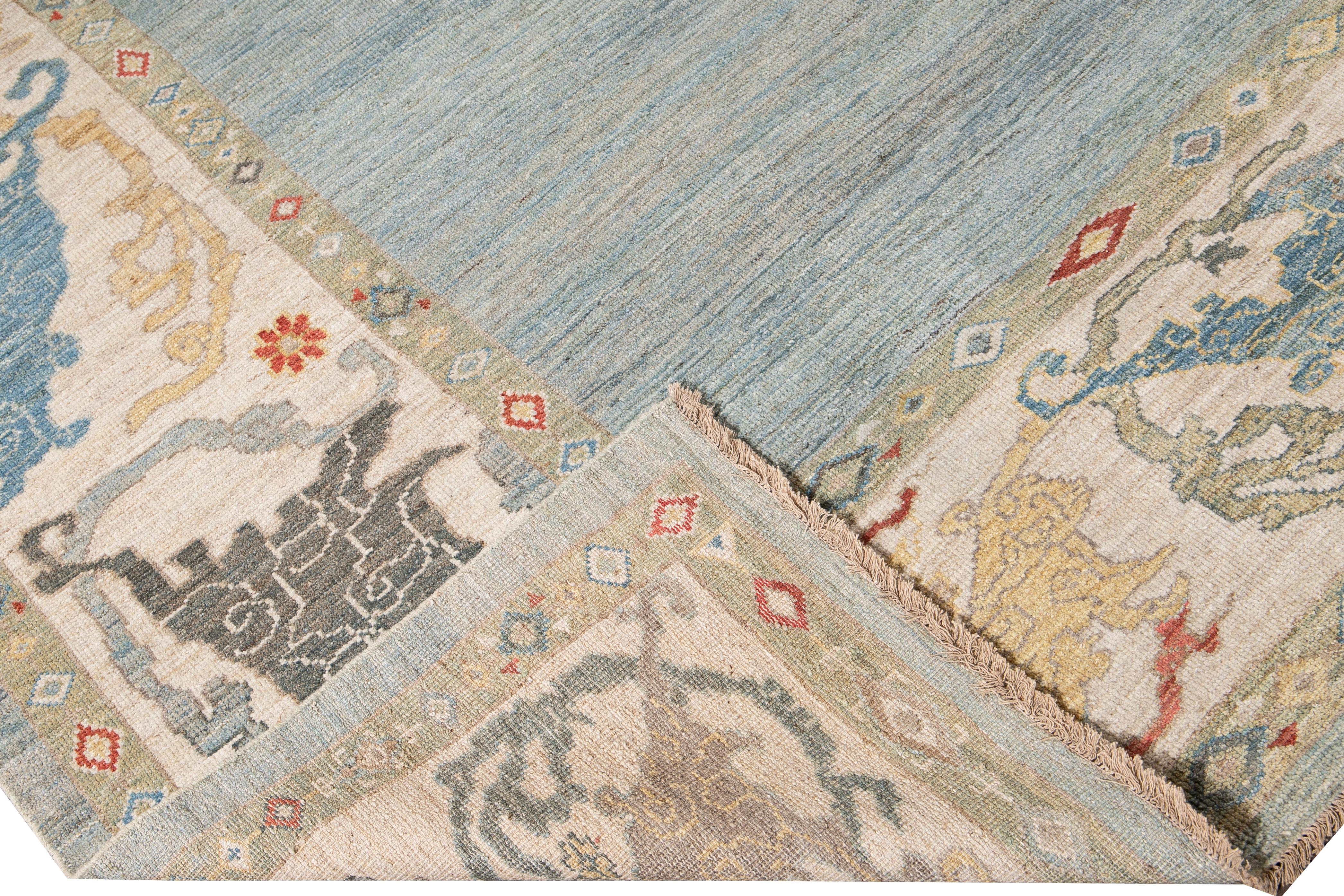 Beautiful modern oversize Sultanabad hand-knotted wool rug with a solid blue field. This Sultanabad rug has a beige frame and golden brown, blue, and orange accents in a gorgeous all-over Classic geometric floral design.

This rug measures: 11'10