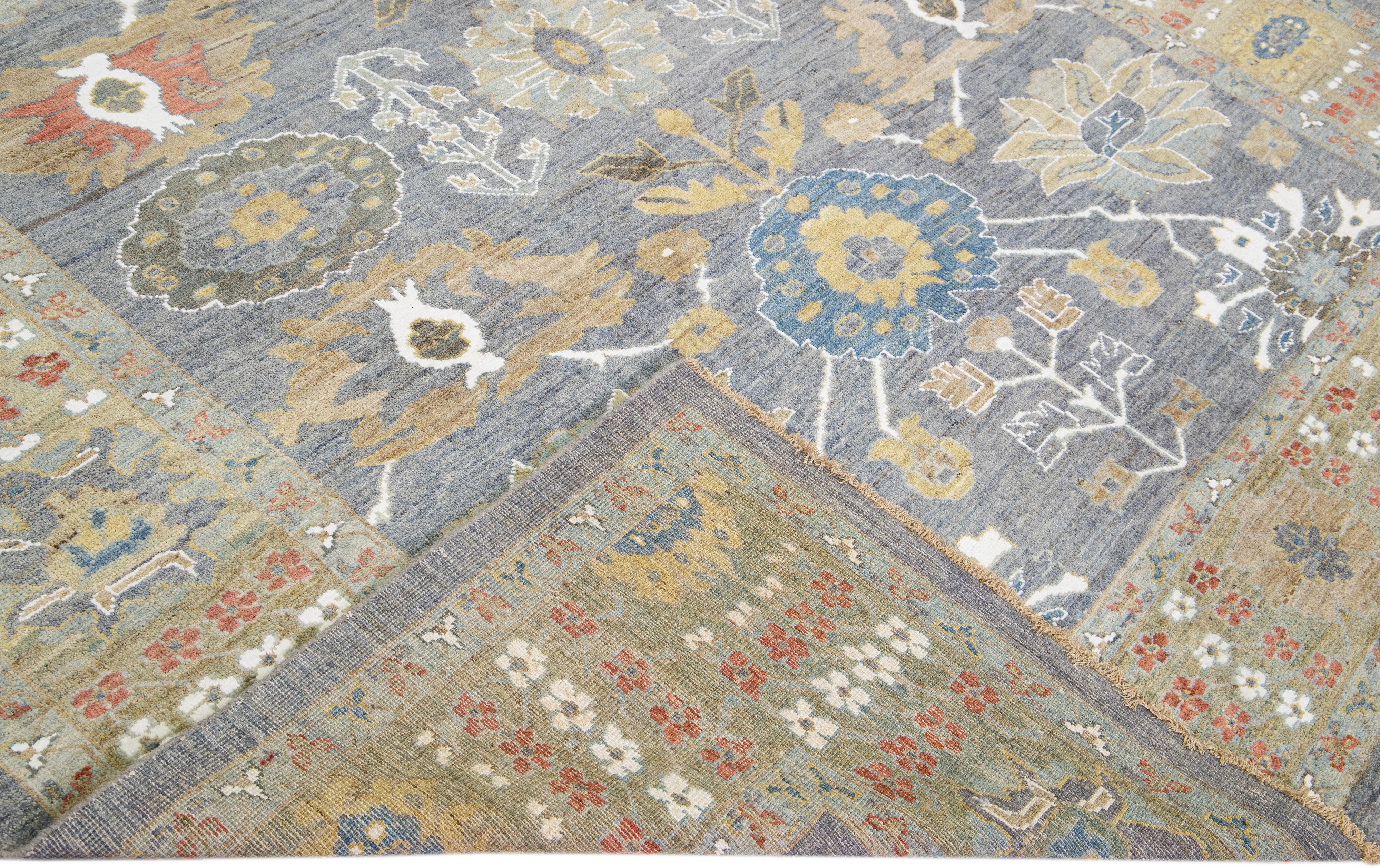 Beautiful modern Sultanabad hand-knotted wool rug with a blue field. This Sultanabad rug has a green frame and multicolor accents in a gorgeous all-over classic floral pattern design.

This rug measures: 8'7