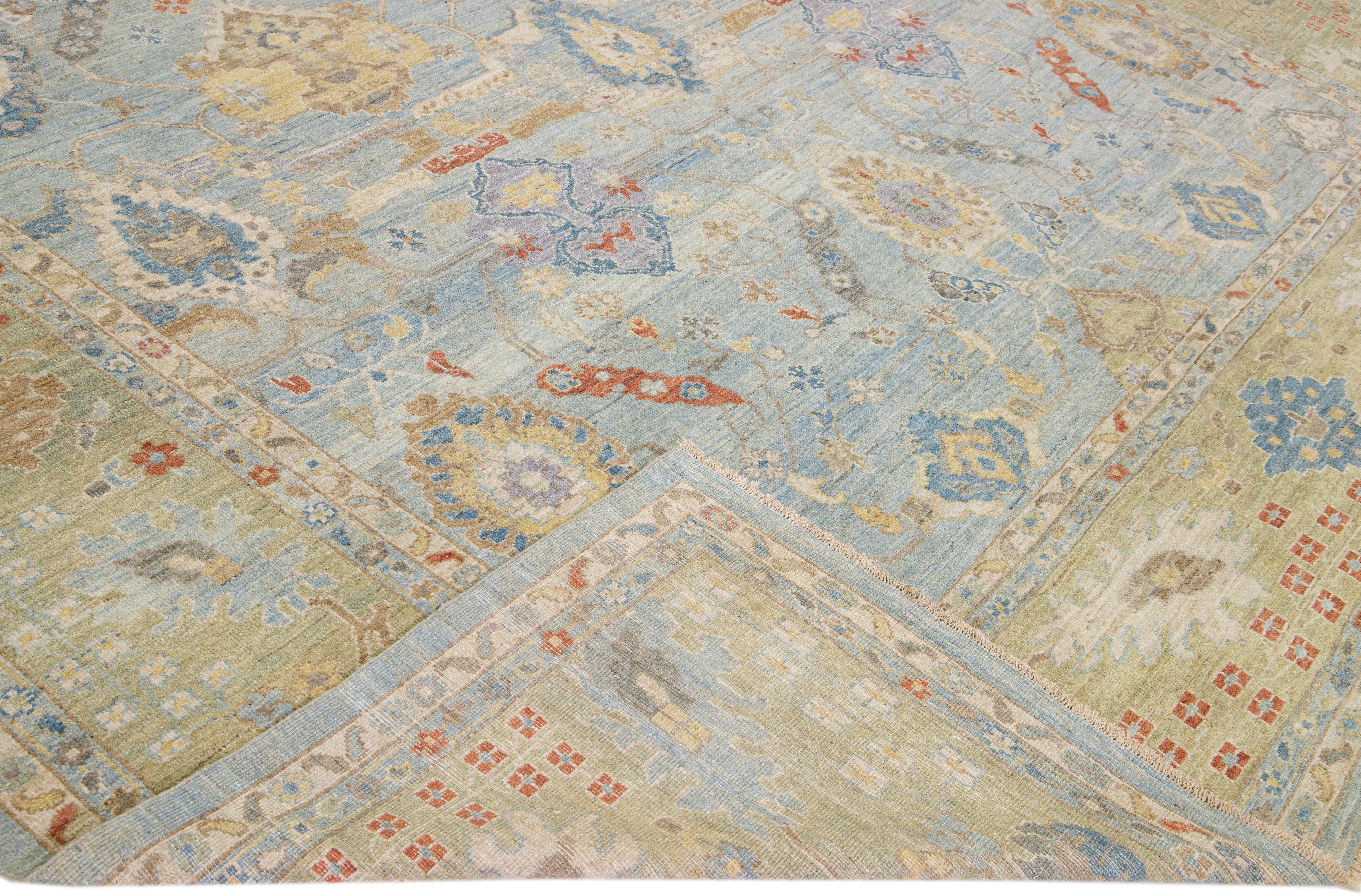 Beautiful modern Sultanabad hand-knotted wool rug with a blue field. This Sultanabad rug has a green frame and multicolor accents in a gorgeous all-over classic floral pattern design.

This rug measures: 12'10