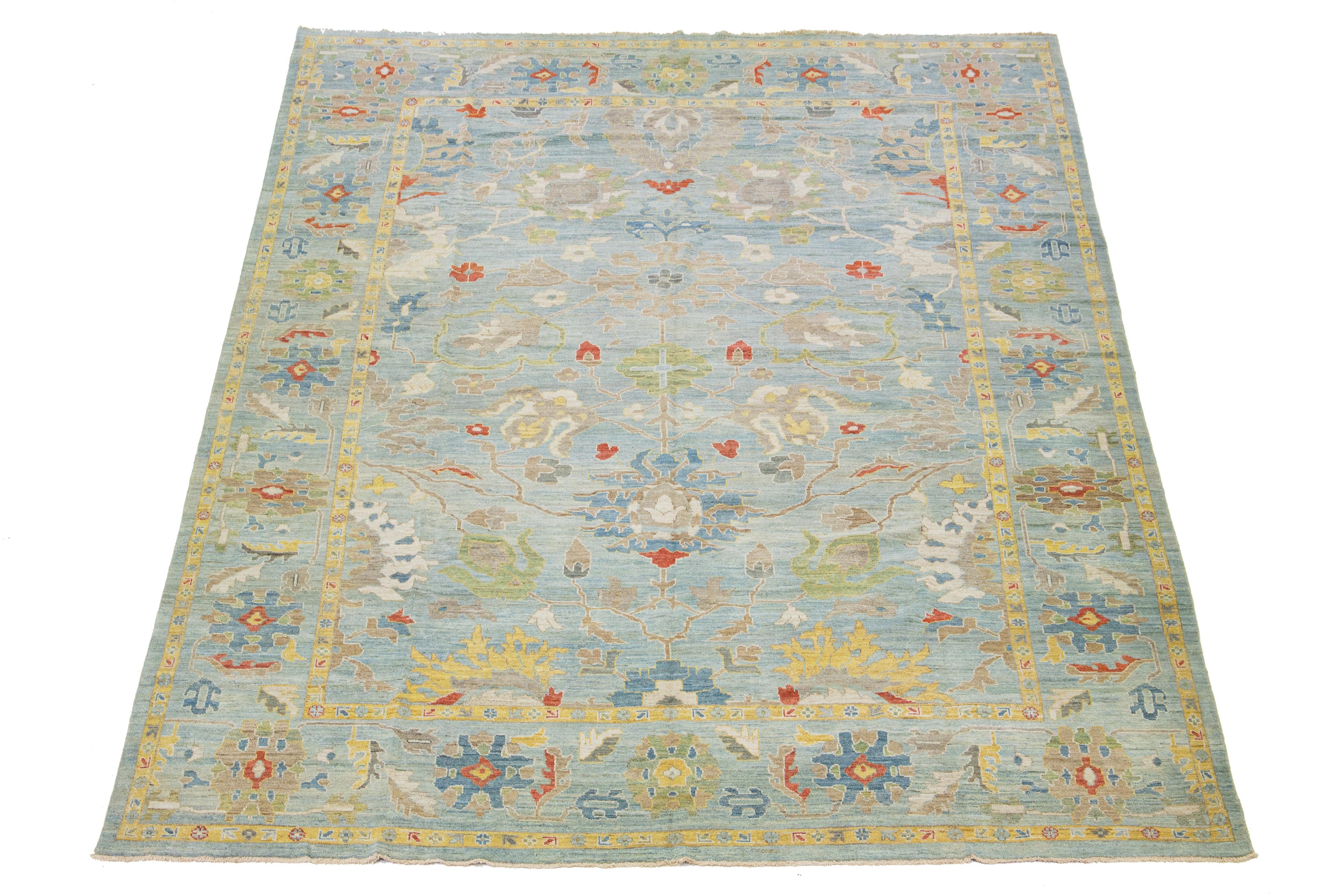 This Sultanabad classic style has been meticulously transformed into a contemporary masterpiece. This wool rug has a light blue field. Its frame has a floral motif. To enhance its elegance, it incorporates a design of multicolored accents.

This rug