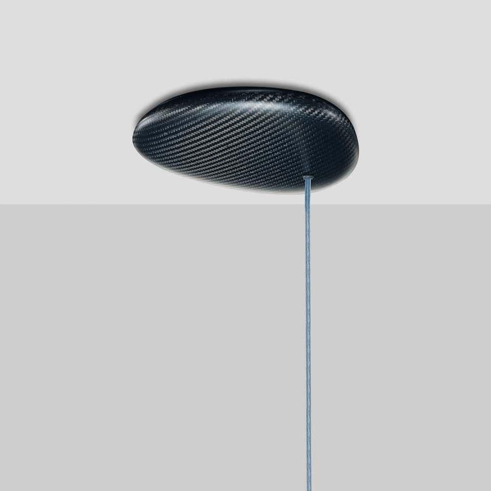 Stunning CARB24.05 is powered by the latest technology. Carbon Light is a high-performing modular suspension light made using the latest LED technology. A feather-light carbon fiber body links highly efficient power LED spots. With an adaptable