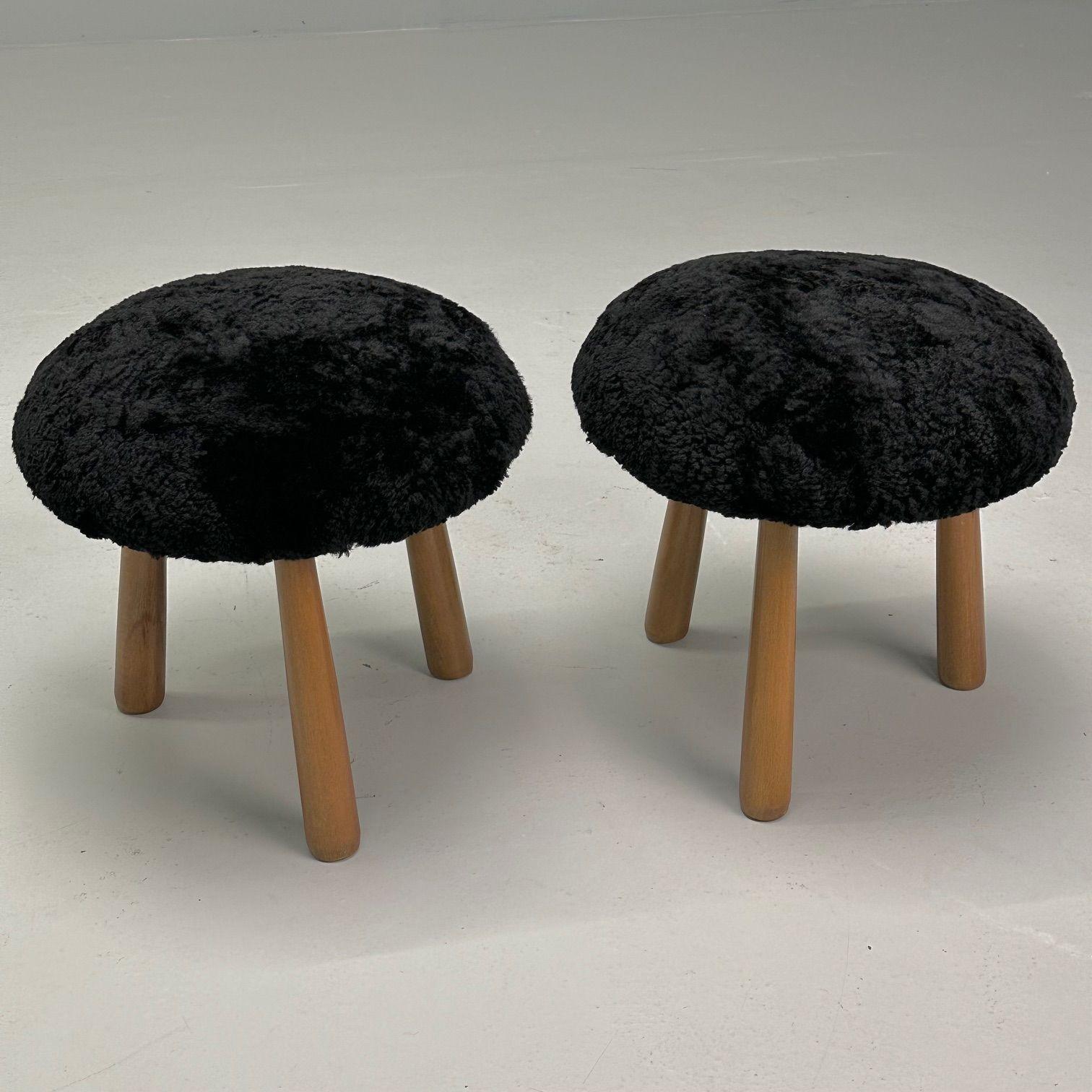 Contemporary, Swedish Mid-Century Style, Tripod Stools, Black Sheepskin

Contemporary organic form tri-pod stools or ottomans. New, comfortable foam cushioning and high quality 17 mm curly black genuine Australian shearling. Overall form and design