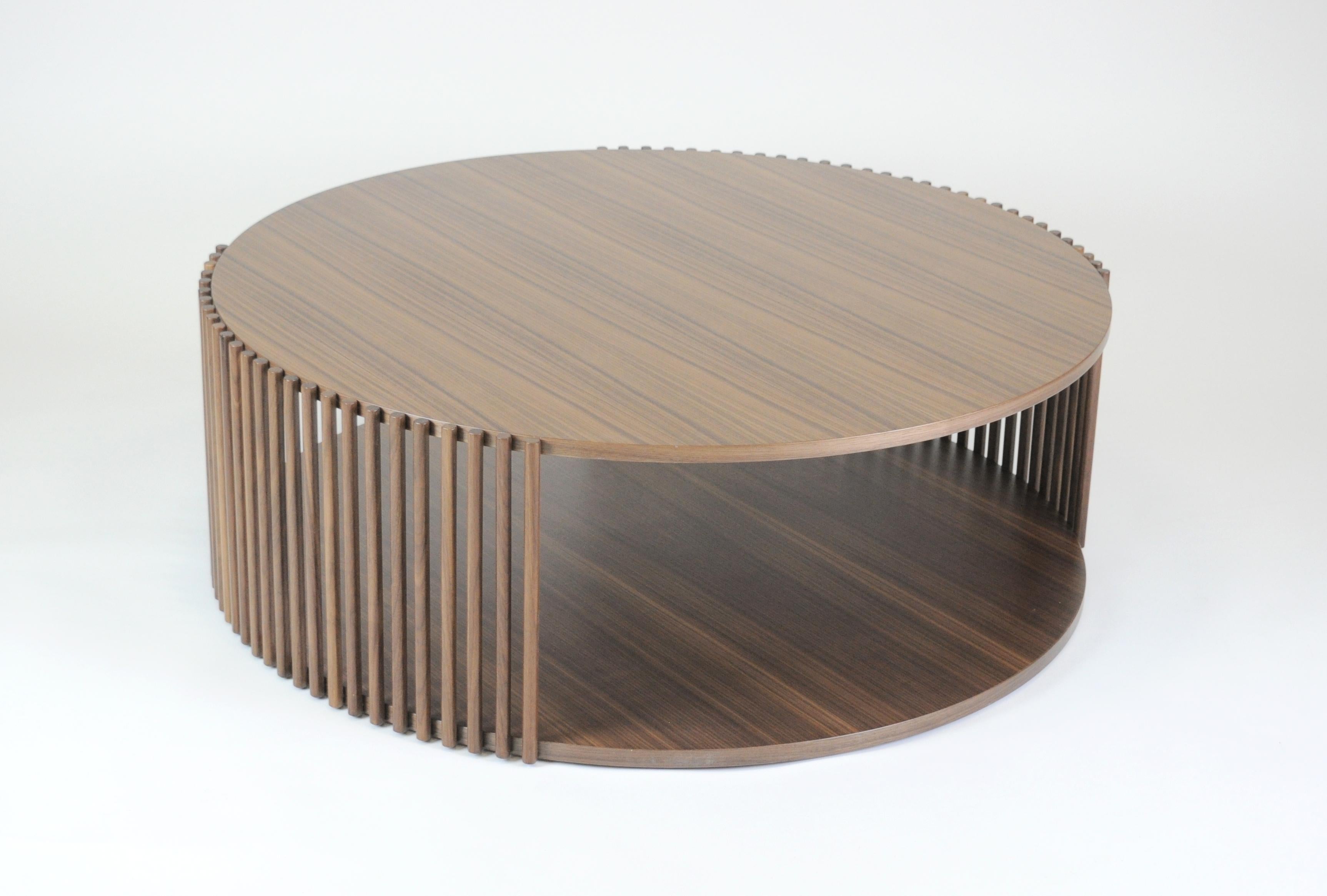 Coffee table from the Palafitte collection, made up of solid wood strips that support the veneered Canaletto walnut tops.
Diameter Ø103xh.40cm.
Venice, the floating city, with its urban system based on a myriad of poles immersed in the water,