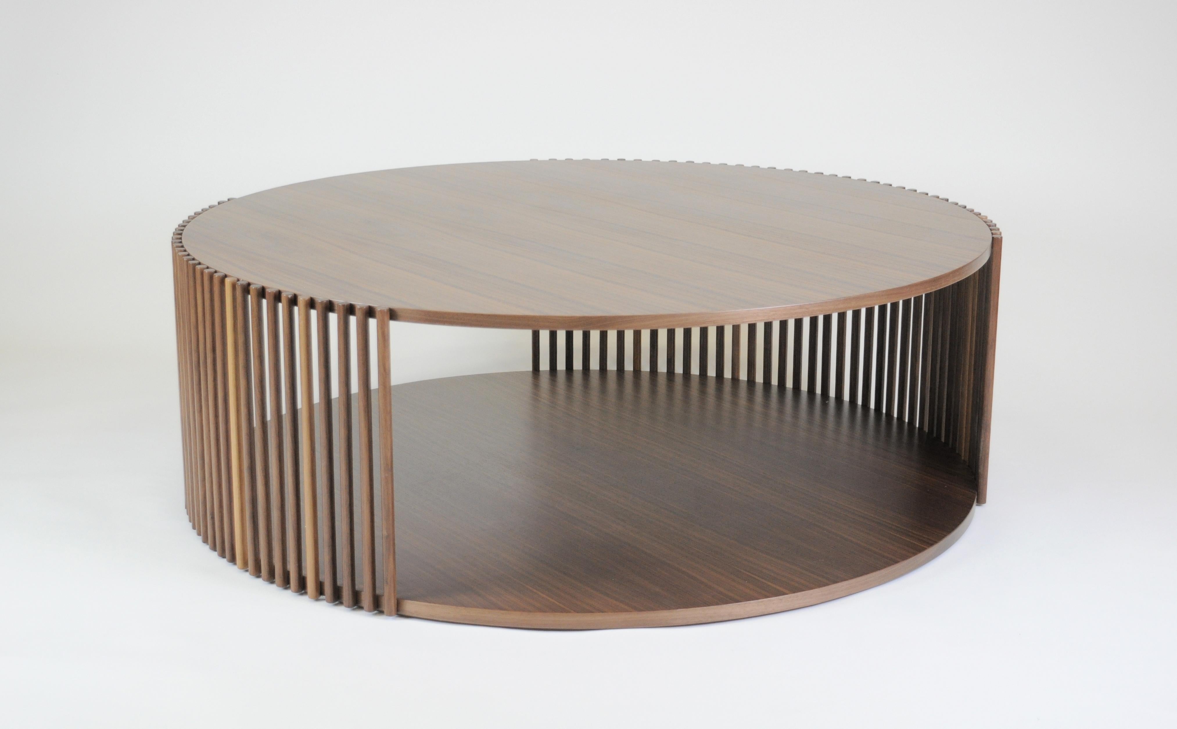 Coffee table from the Palafitte collection, made up of solid wood strips that support the veneered Canaletto walnut tops.
Diameter Ø123xh.40cm.
Venice, the floating city, with its urban system based on a myriad of poles immersed in the water,