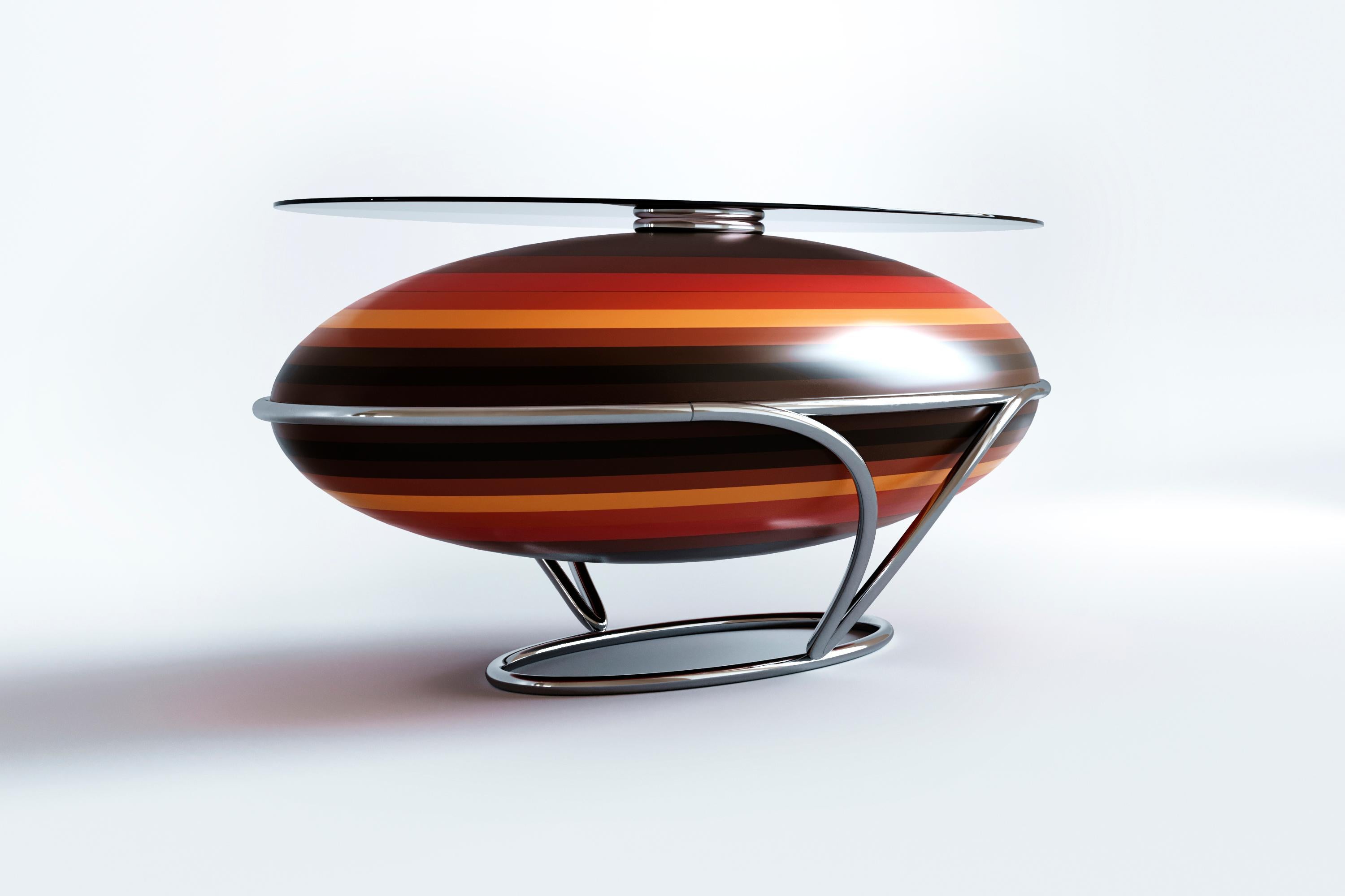 The table from the Eggs collection is another successful contemporary variation of the up-to-date aesthetics of retro-futurism. Spherical shape, bright-colored stripes that contrast with the natural texture of dark wood, varnish, metal stand, and a