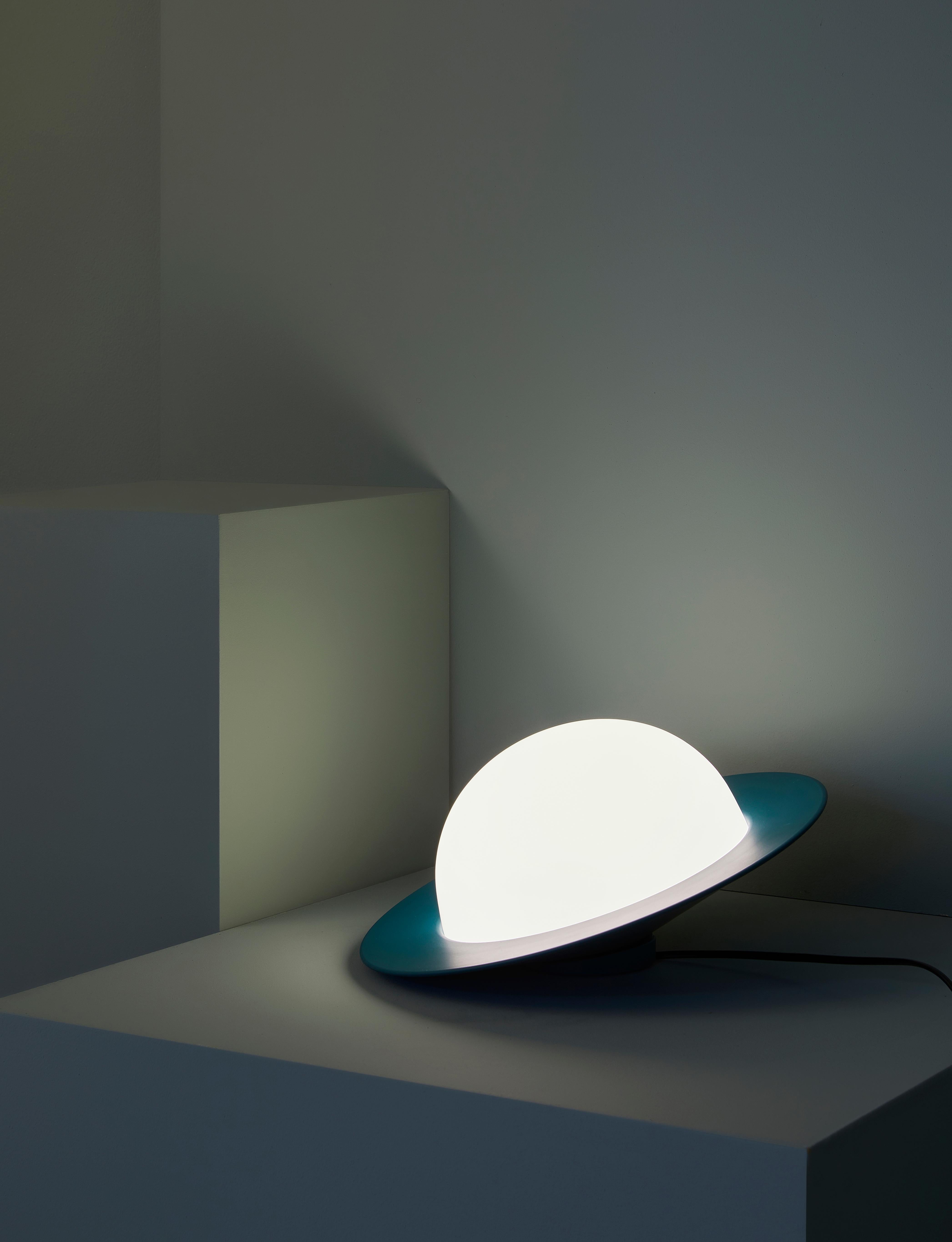 Alley table lamp by AGO Lighting
UL Listed

Painted aluminum, white opal glass
LED G9 110-240V (not included)

Available colors:
Charcoal, white, grey, burgundy and green

Measures: Tilt version
16.2 x 32.2 cm (Large)
11.4 x 22.7 cm (Small)

Still