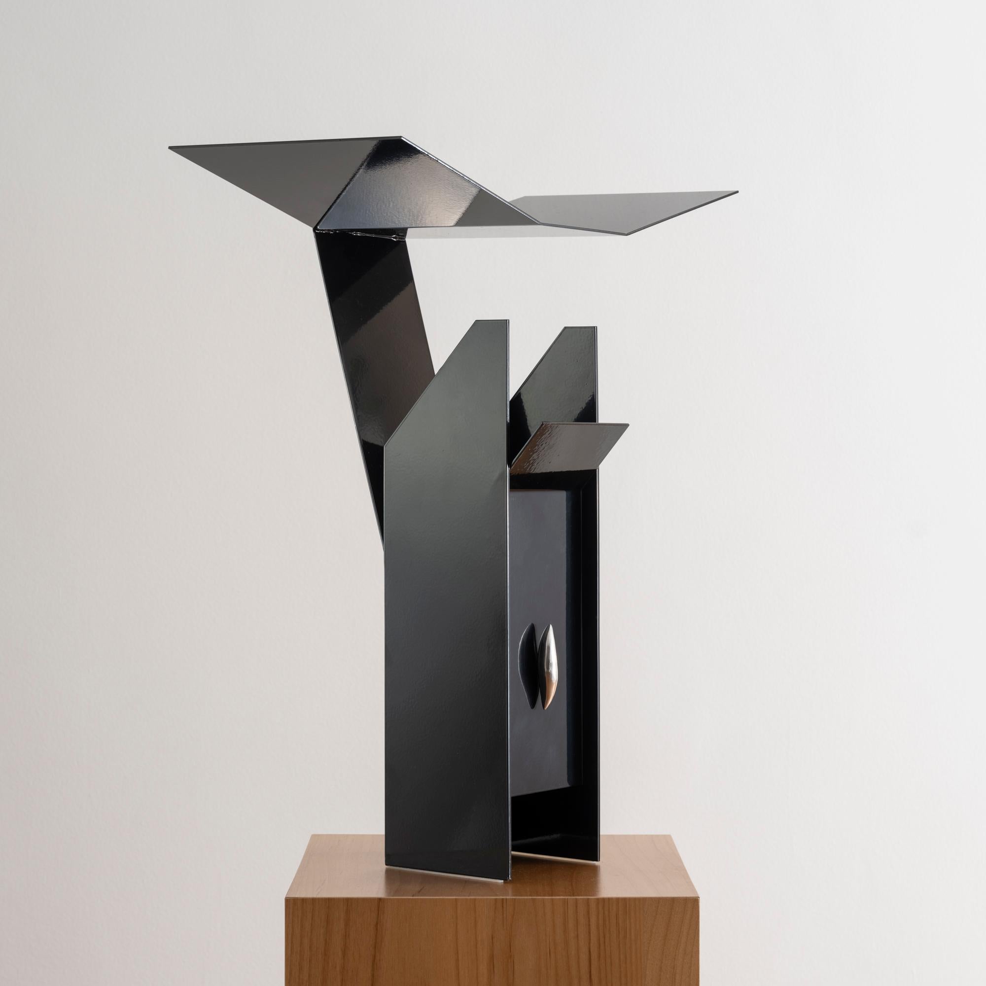 Designed by EJR Barnes in 2023, this contemporary industrial-style steel table lamp is sculpturally bent into an angular shape to artfully reflect and diffuse light beneath a folded metal canopy. 

Entitled 