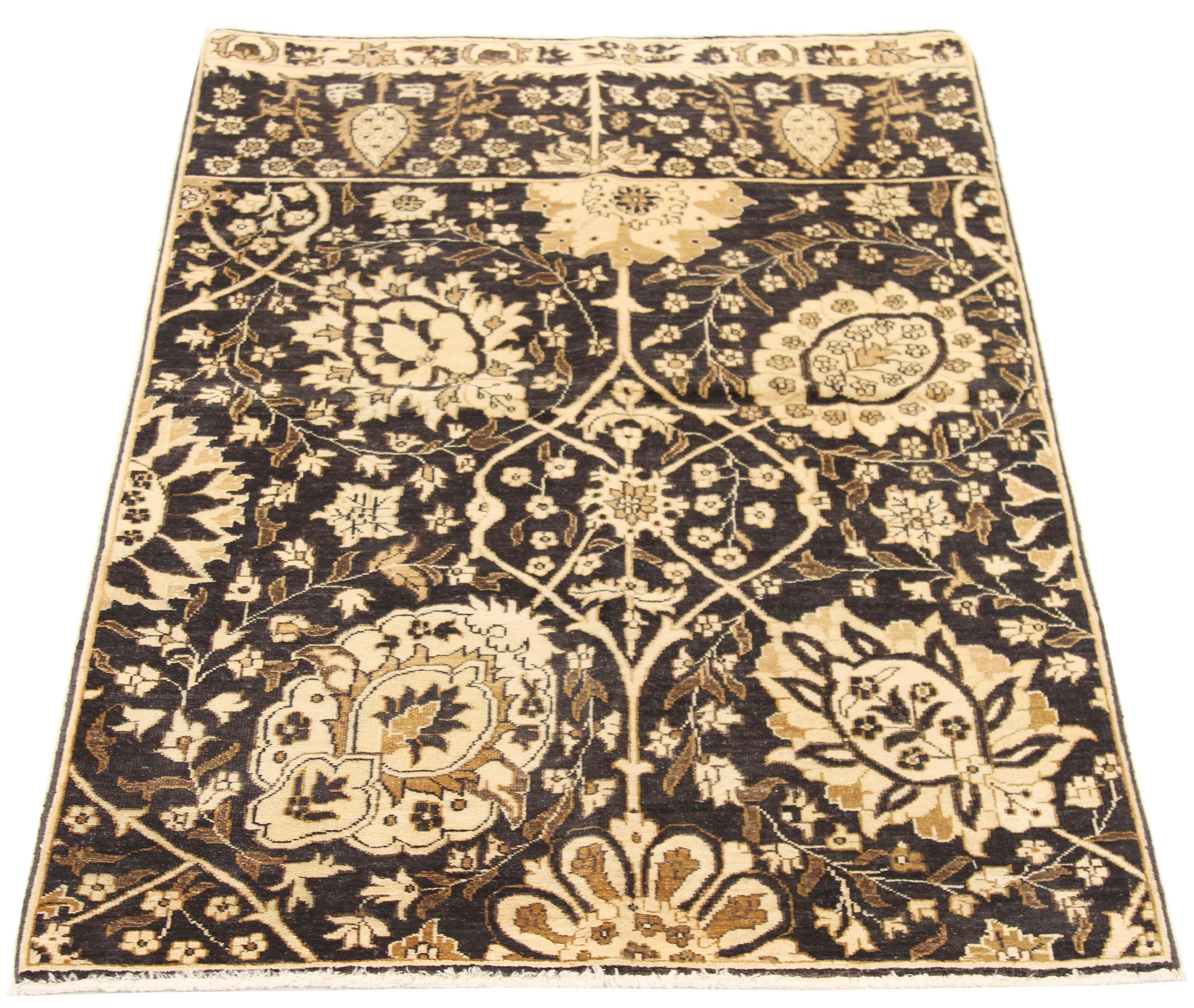 Contemporary Persian rug handwoven from the finest sheep’s wool and colored with all-natural vegetable dyes that are safe for humans and pets. It’s a traditional Tabriz weaving featuring a lovely ensemble of floral designs in black and brown over an