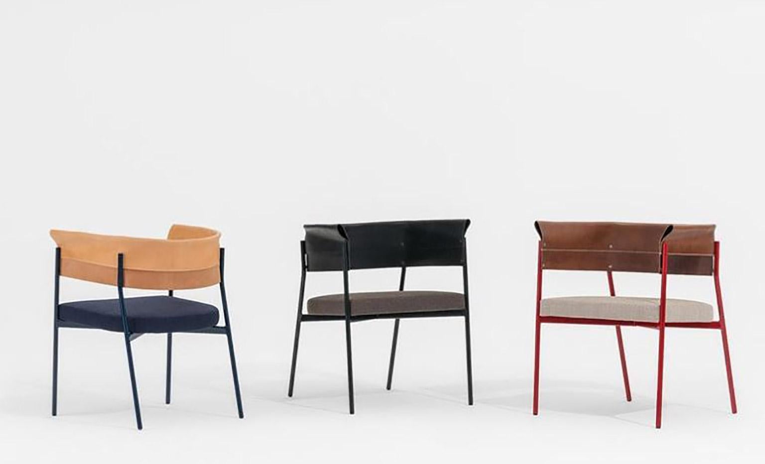 Armchair made with a thin and elegant hand-welded steel frame whose curvature supports the precious leather, folded and sewn to act as a backrest and the same time as an armrest. Available in red, blue, black structure as per the full-grain leather