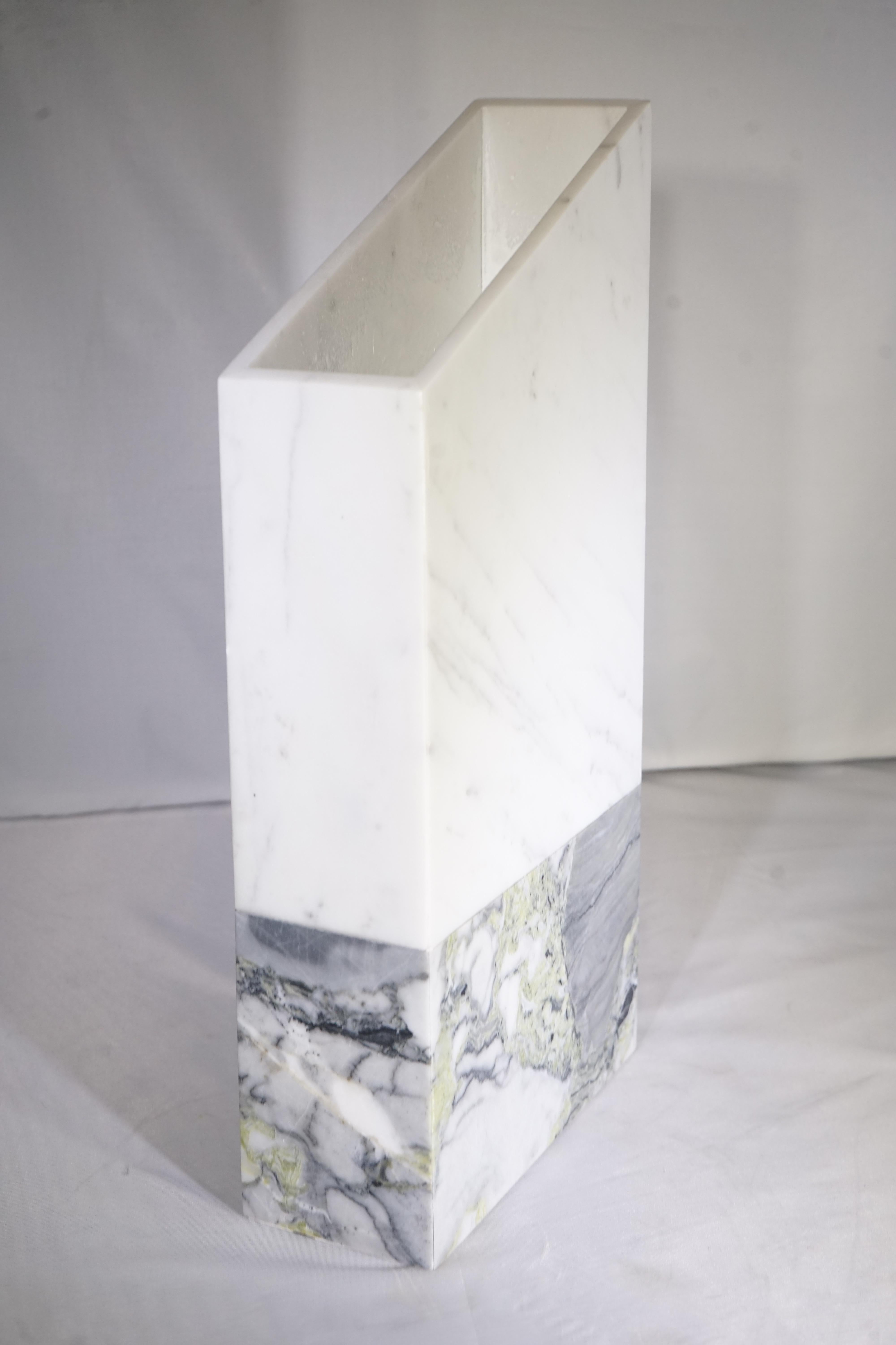 Contemporary tall marble vase with white and grey upper portion and green and grey marble lower portion.