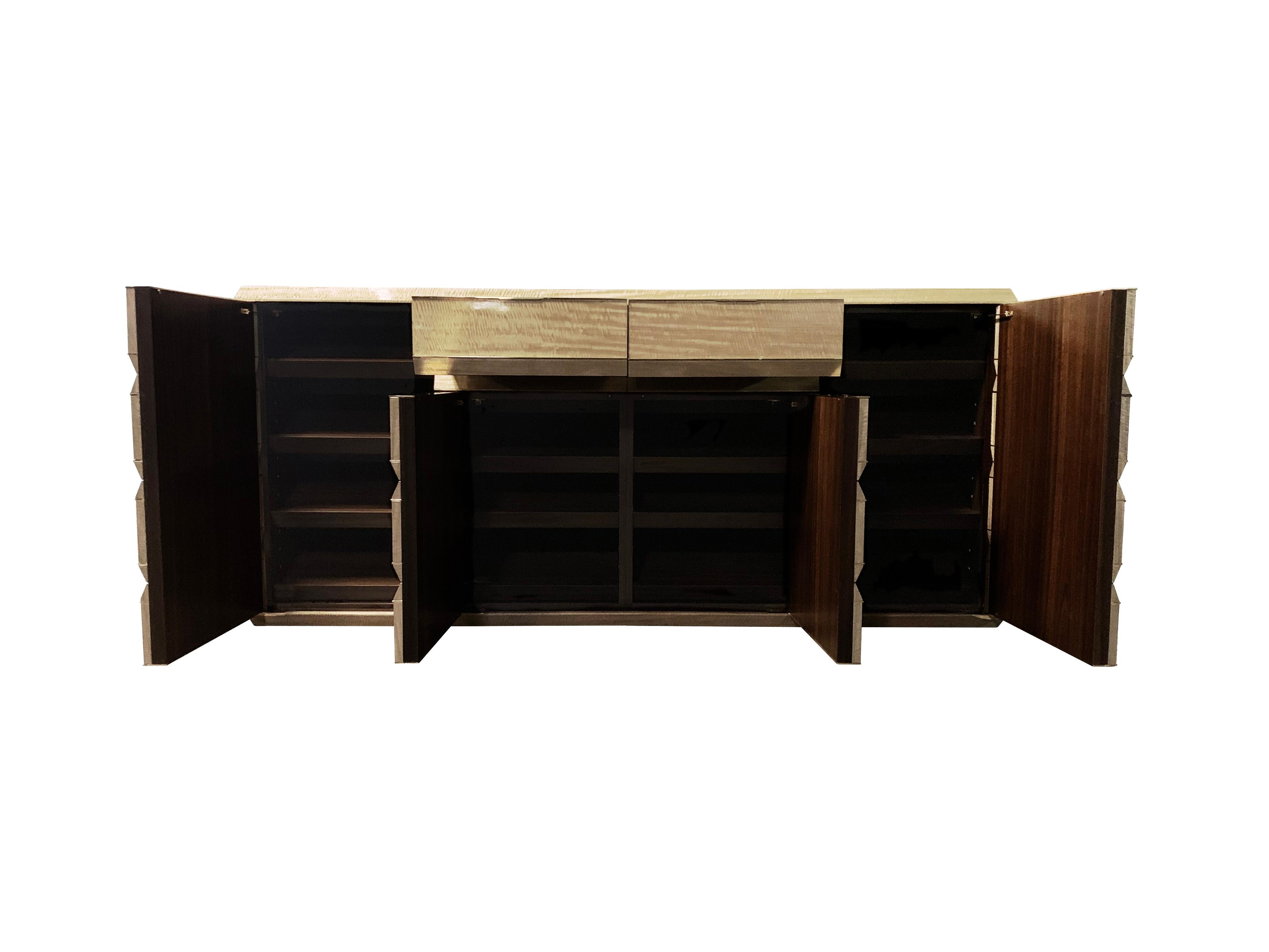 Contemporary Tanganyika wood, brass, and polished stone bedroom credenza shoe cabinets 

A pair of custom Tanganyika wood bedroom shoe credenza’s designed by London based Interior Designer Martin Kemp. Created and assembled by the esteemed English