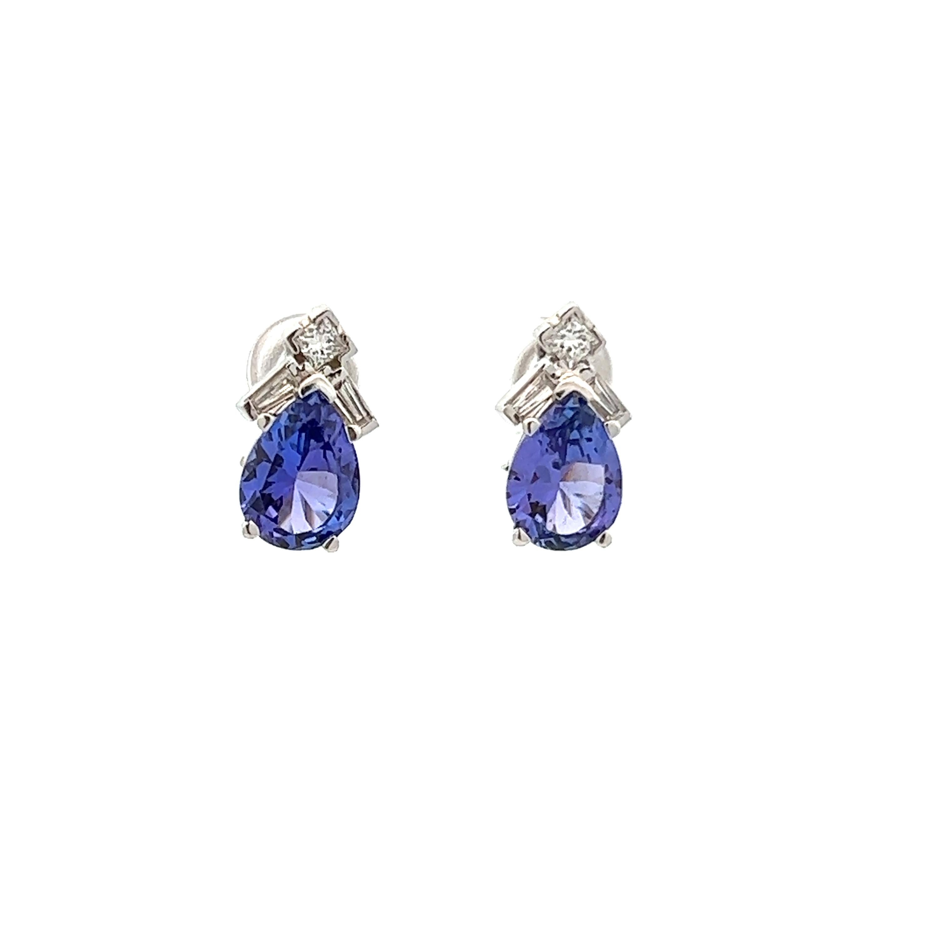 This lovely pair of contemporary earrings, made in 14k white gold, have both tanzanite and diamond. These earrings contain 1.00 cttw G color, SI1 clarity diamonds as well as 4.50 cttw of pear cut tanzanite. THe combination of of tanzanite, white