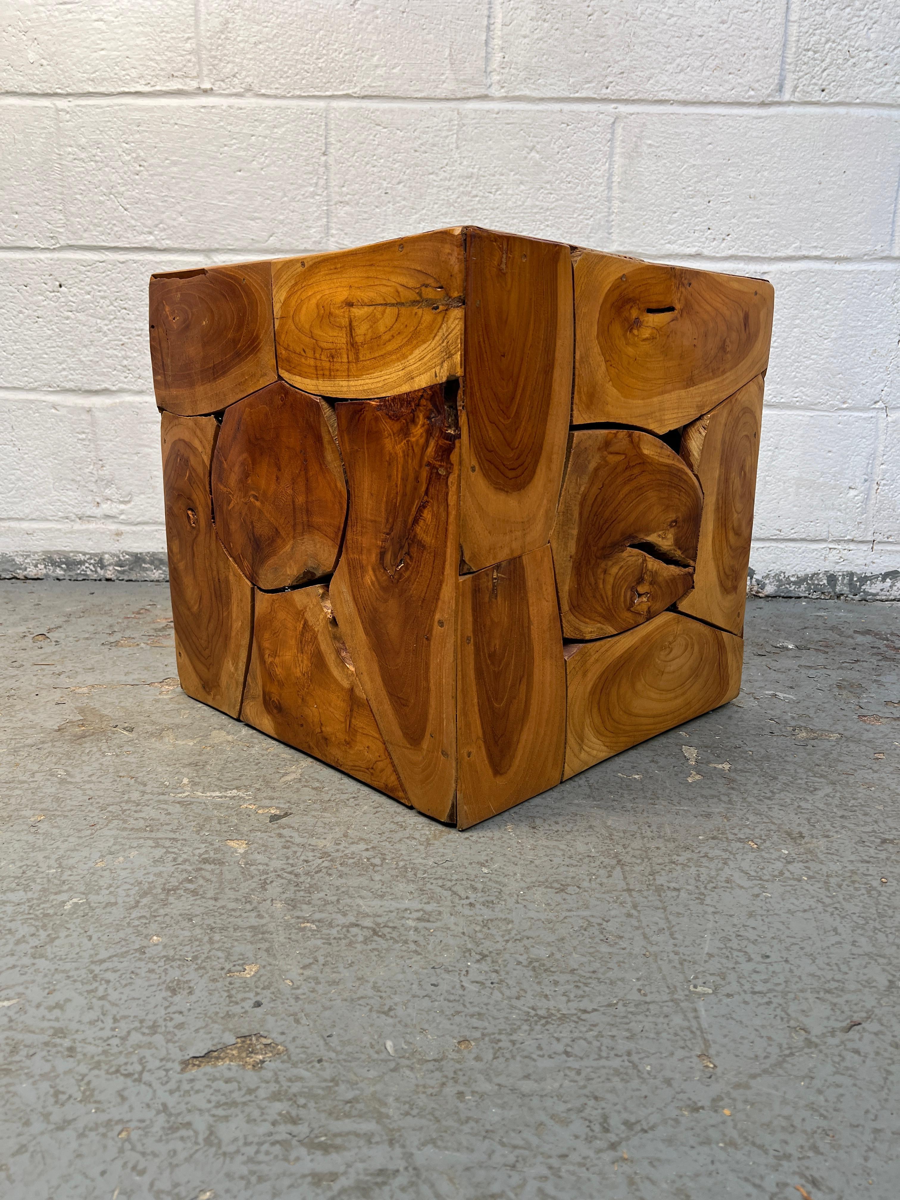 Unique end table crafted from a collection of circular tree trunk slices. Its natural wood texture and sculptural design make it a striking accent piece for any living room or side space, blending rustic charm with modern style.

Please confirm item