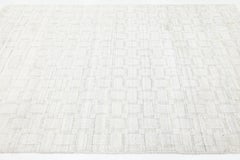 Alfombra contemporánea de estilo marroquí con textura, en mezcla de lana y viscosa en tonos marfil y crema